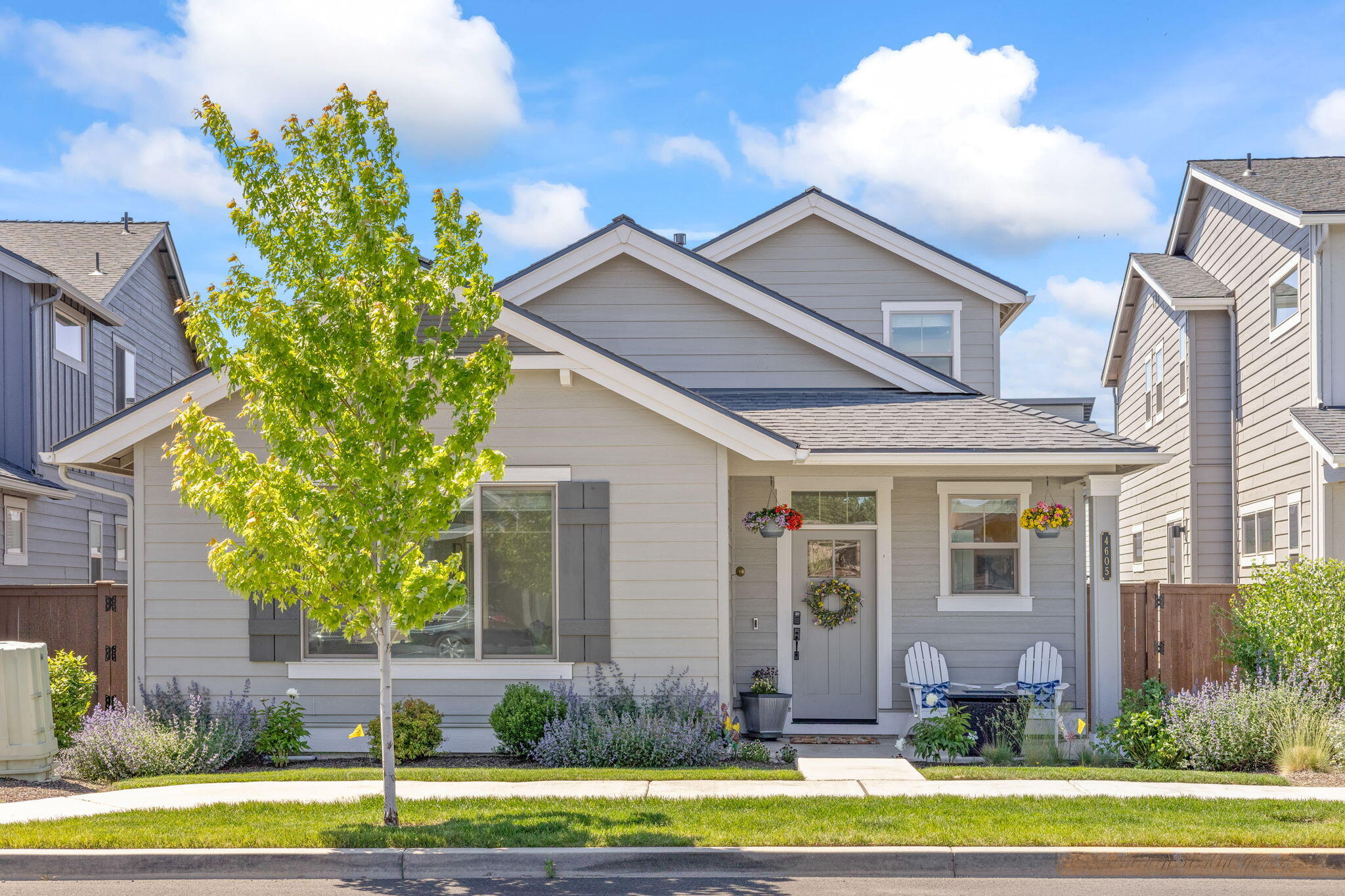 This charming 3-bedroom, 2.5-bath home offers 2,108 sq ft of comfortable living space in a peaceful neighborhood just a 10-minute drive to Bend. Enjoy a welcoming covered front porch and a spacious great room with a coffered ceiling and cozy gas fireplace. The primary suite on the main floor features a walk-in closet and dual sinks, providing a perfect retreat. Upstairs, you'll find a versatile loft area and a walk-in linen closet. Additional highlights include a 2-car garage with additional shop/workspace, community pool, scenic walking trails along the canal, and proximity to great schools—all in a quiet, family-friendly community.