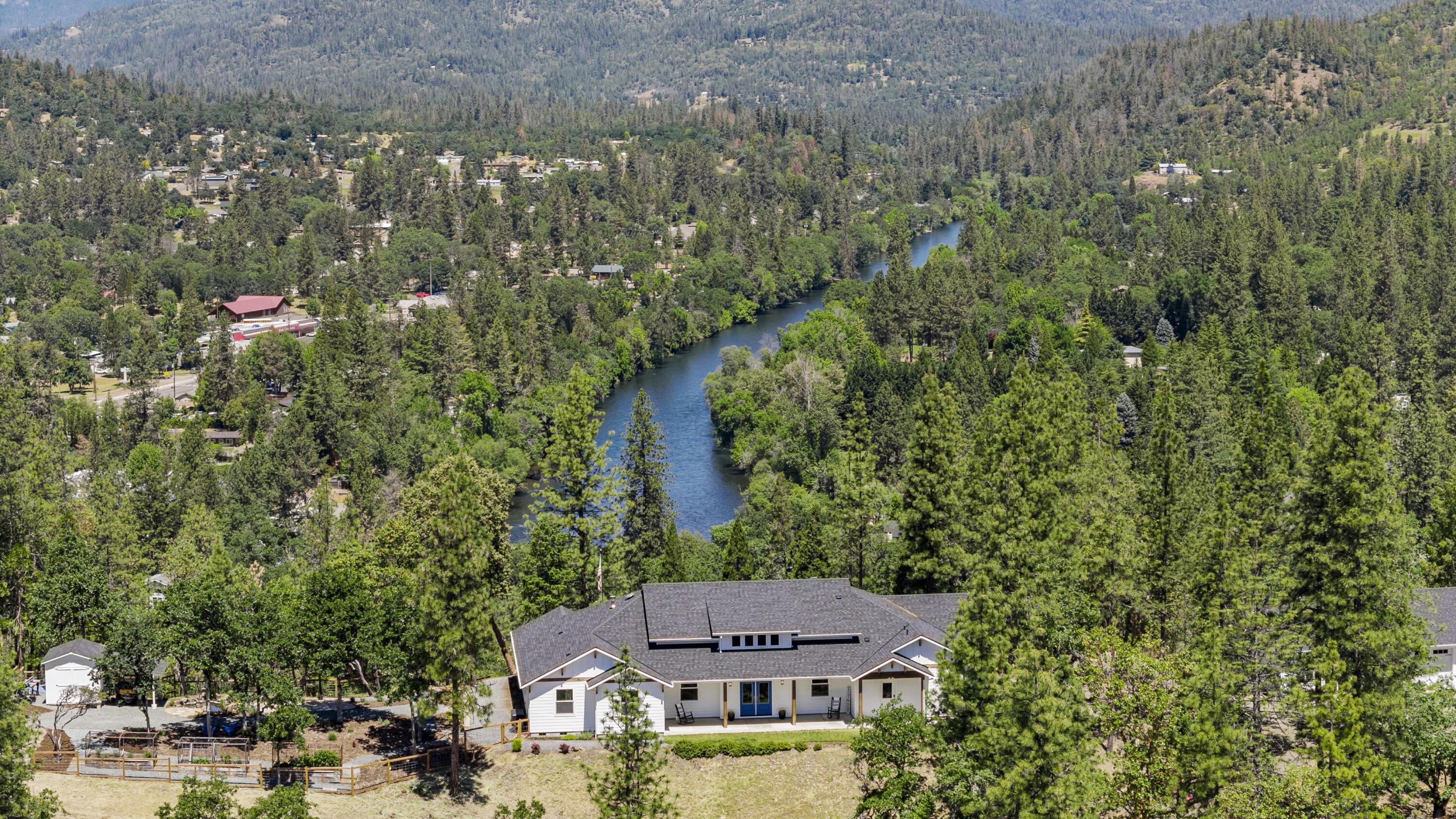 Absolutely stunning Michael Susi quality built home on 15 private acres with panoramic mountain and Rogue River views, minutes from town. This 4 bed + Office 3101 sf home is the epitome of luxury with quality contemporary finishes throughout.  Master En-Suite features His and Her private vanities, built in steam sauna, soaking tub, beautiful tiled shower, oversized luxury closet and laundry room exactly where it makes sense.    Gorgeous open kitchen with plenty of storage, island with prep sink,  private butler's pantry with prep sink, secondary fridge and more.  Outside is a finished 3 car garage with attached Legal ADU, currently used as a gym with it's on private bathroom. (kitchen and flooring needed to finish to use as living facilities).  Enjoy the peace and quiet on your covered back patio with outdoor entertainment area featuring linear fireplace , TV and fans, koi pond, fenced garden areas, park like setting with your own hiking trails and more.  All this AND Amazing Internet
