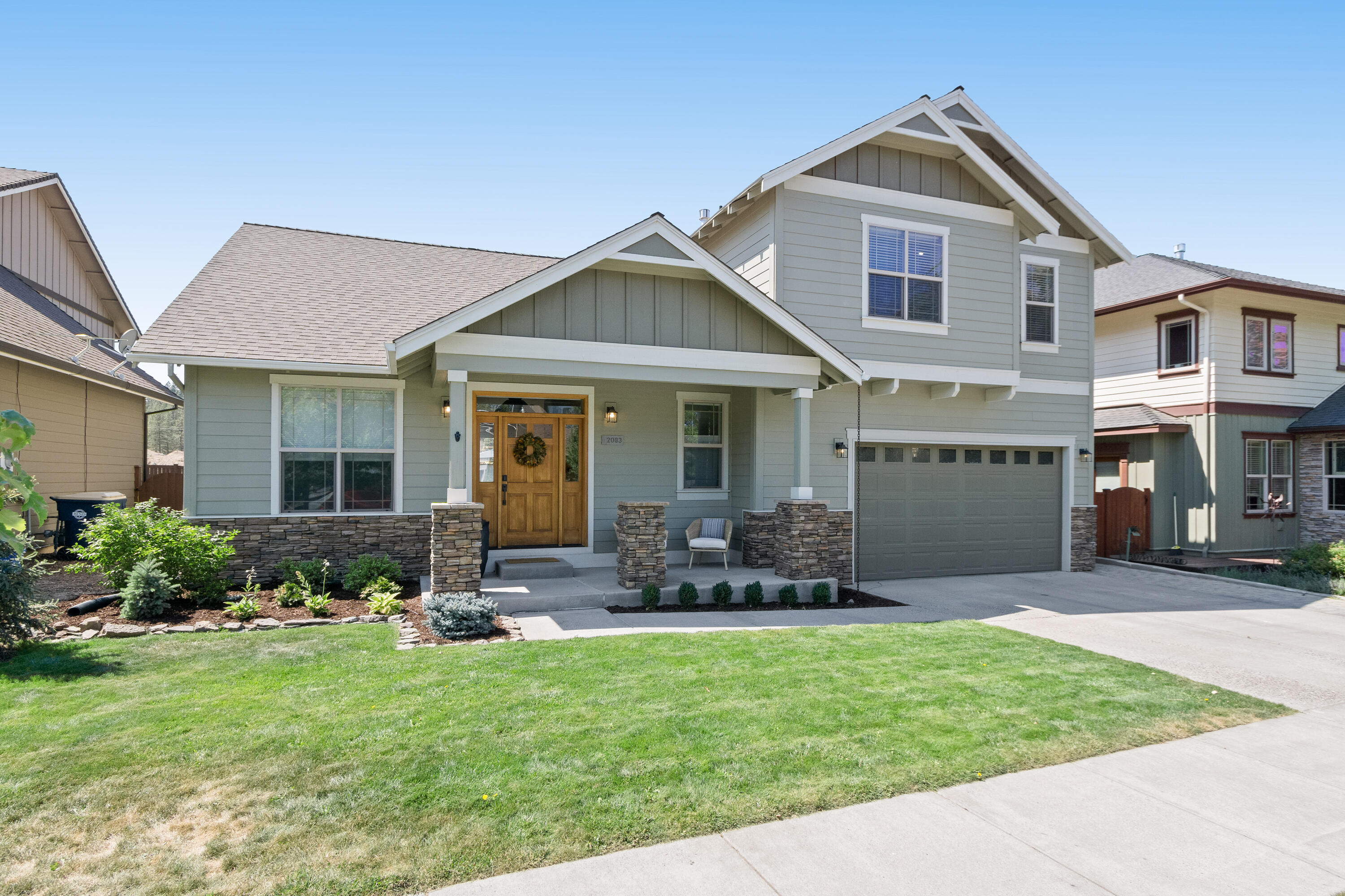 This beautifully updated NW Bend residence is set west of downtown, near coveted Shevlin Park and NorthWest Crossing. Nestled just around the corner from Discovery Park, this home is conveniently located close to schools, restaurants, shops, and miles of trails.  Extensive updates include wood floors, slab quartz counters and backsplash in the kitchen, new lighting, interior paint throughout, custom built-ins, gas fireplace, and more.  The light-filled main level features a dedicated office, half bathroom, and expansive great room and kitchen with vaulted ceilings.  The primary bedroom with en suite bathroom rounds out the main level living space. The second floor features two guest bedrooms, a bathroom, and a large bonus room. The garage features ample storage and separate studio space, which makes an ideal exercise room.  A covered patio, fully fenced and landscaped yard, and an additional fenced side yard, complement this unique offering in the wine streets.