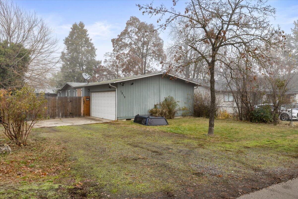 Affordable 2 bedroom/1 bathroom on nice sized lot with a grand back yard and attached 2 car garage. This home is located in the Oak Grove school district, ideal for investors or first-time homebuyers seeking a comfortable, move-in ready property. This home offers exceptional privacy with complete fencing extending from the front of the garage around the entire property. The attached two-car garage provides additional parking and convenient access. The kitchen features ample cabinet space, and all appliances are included. Most of the flooring is laminate and the living room includes a slider leading to the side yard, with a dining area adjacent to it. The home is equipped with newly installed forced air heating and A/C, along with a certified pellet stove to help keep heating costs down. Plus, there's a dog run. Considerable room sizes with generous master and walk-in closet. The property boasts a spacious, fully fenced backyard, perfect for pets or outdoor enjoyment.