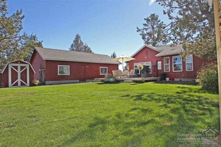 Absolutely delightful Cimmeron City mini estate with all the bells & whistles. This incredibly private 1580 s/f 3 bed, 2 bath home is nestled at the end of a quiet street surrounded by natural landscaping. Single level with living & family rooms, huge garage/shop & additional sheds. Manicured front yard and giant back yard perfect for entertaining! Easy access to pubic land, an ideal hobby farm! Master with private patio. High efficiency pellet stove, vaulted ceilings and ceiling fans. Make it yours!