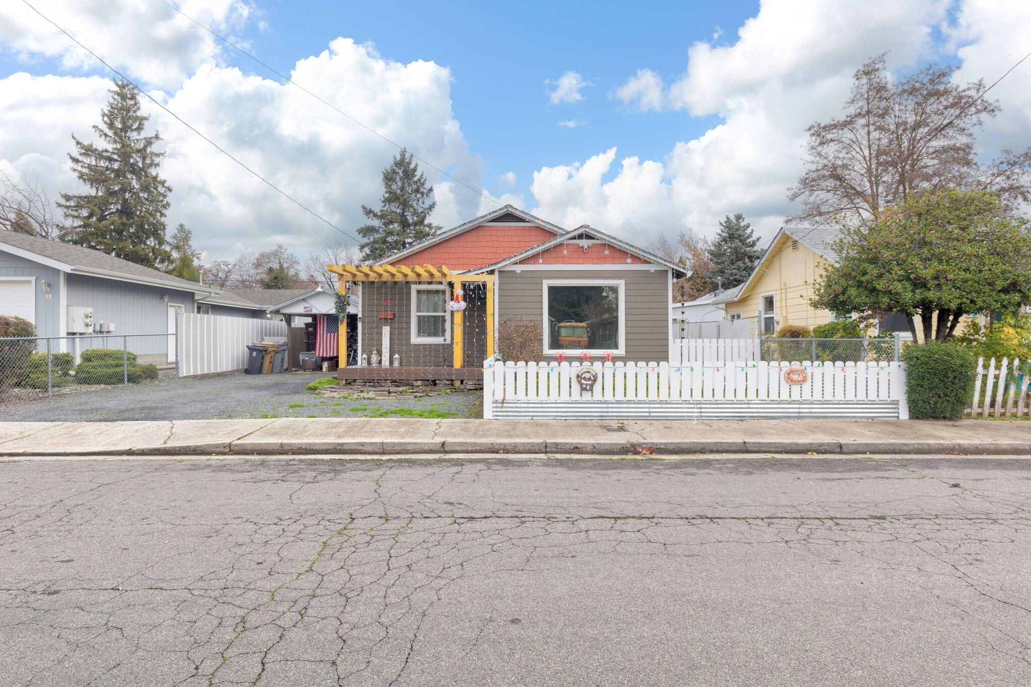 Charming 2 bed, 1 bath home in the heart of Grants Pass, blending 1940s character with modern updates. Features include new windows, mini-splits, a 50-year roof, HardieBack siding, hardwood floors, new bedroom carpet, fresh interior/ exterior paint, and fenced front & back yards with a welcoming front deck. Ideal for first-time buyers or investors seeking rental income.
