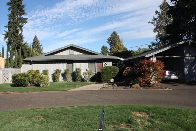 Old East Medford prime location. Large lot with in-ground gunite pool. Over 2,250 sq. ft. with 5 bedrooms and two baths. Beautiful court yard leading to studio or shop. Vaulted ceilings, newer heat and air, newer hot water heater, and newer roof. Tons of potential for this home. Park next door has tennis, pickle ball, and basketball courts. Close to RVMC,RVCC, schools, and multiple parks. Circular drive way with plenty of room for toys. Multiple storage sheds.