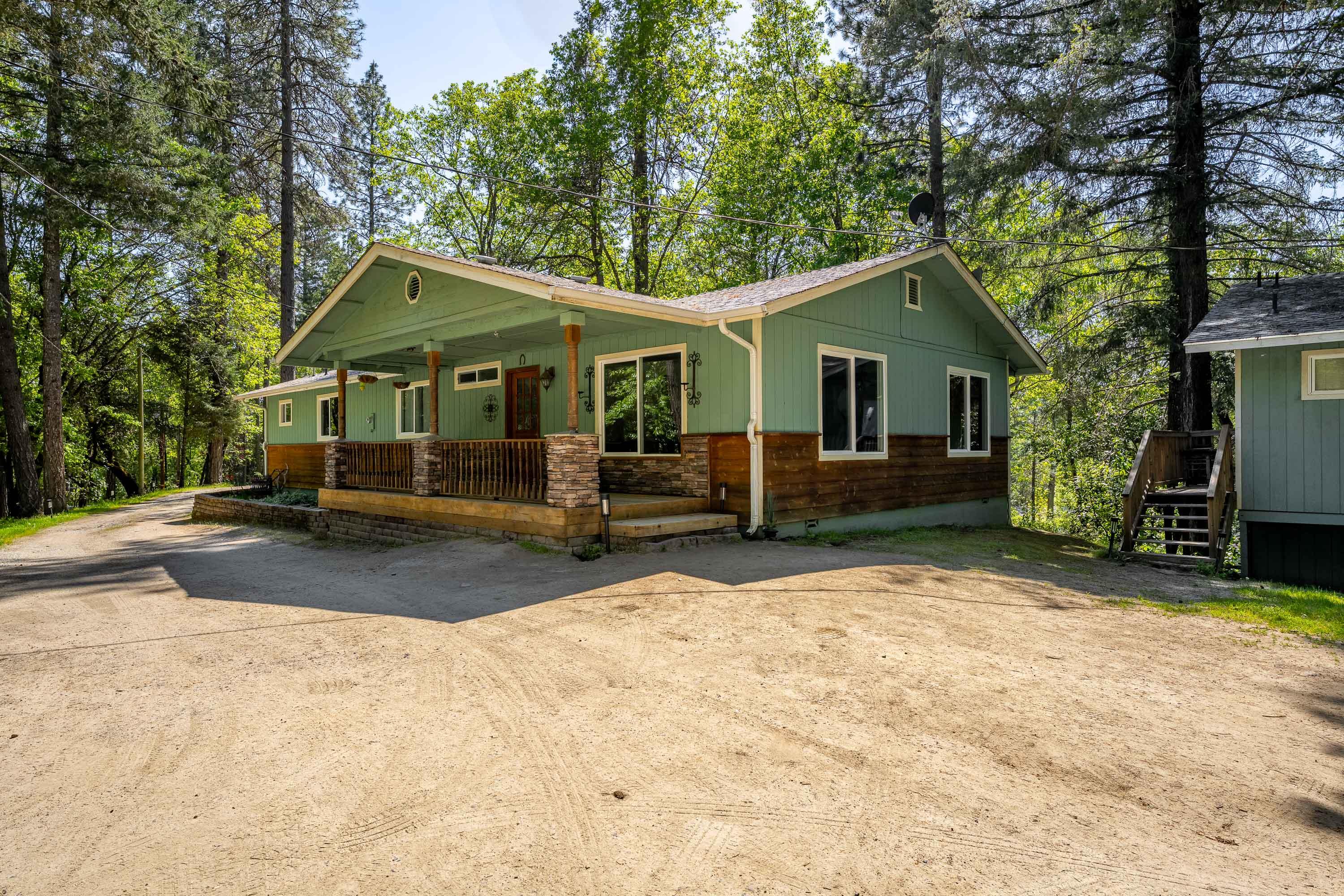 Charming Country Home on 2.78 Acres with Pond & Guest Quarters. Enjoy peace and privacy in this beautifully maintained country home, tucked away in a quiet neighborhood and backed by BLM land. Set on 2.78 acres with mature trees, a creek, and a serene pond, this move-in ready property offers stunning views from the primary bedroom, dining area, and family room. French doors open to a newly stained back deck—perfect for relaxing or entertaining.The main home features 1,680 sq ft, 3 bedrooms, 2 bathrooms, and vinyl windows throughout. Additional living spaces include a 720 sq ft rented guest house (1 bed, 1 bath) and a separate 528 sq ft mother-in-law unit.
Water is plentiful with a private well producing 19 GPM (per seller), plus access to a shared well. Whether you're seeking tranquility, rental income, or multi-generational living, this unique property has it all.
A must-see!