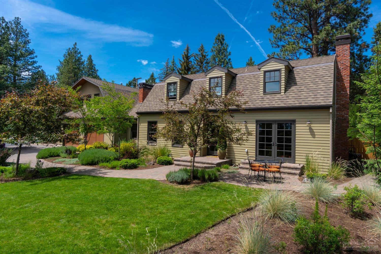 Rare find in the West Hills! Classic Bend home on a large lot and an additional wooded lot. Within walking distance to downtown, the home offers a private and serene setting with territorial views, surrounded by majestic Ponderosas. Perfect for families and entertaining: chef's kitchen adjacent to cozy family room with fireplace, formal living and dining, den, and large sunlit bedrooms. Bonus room above 3-car garage has full bath and walk-in closet, use as a 4th bedroom, guest suite, office or hobby room.