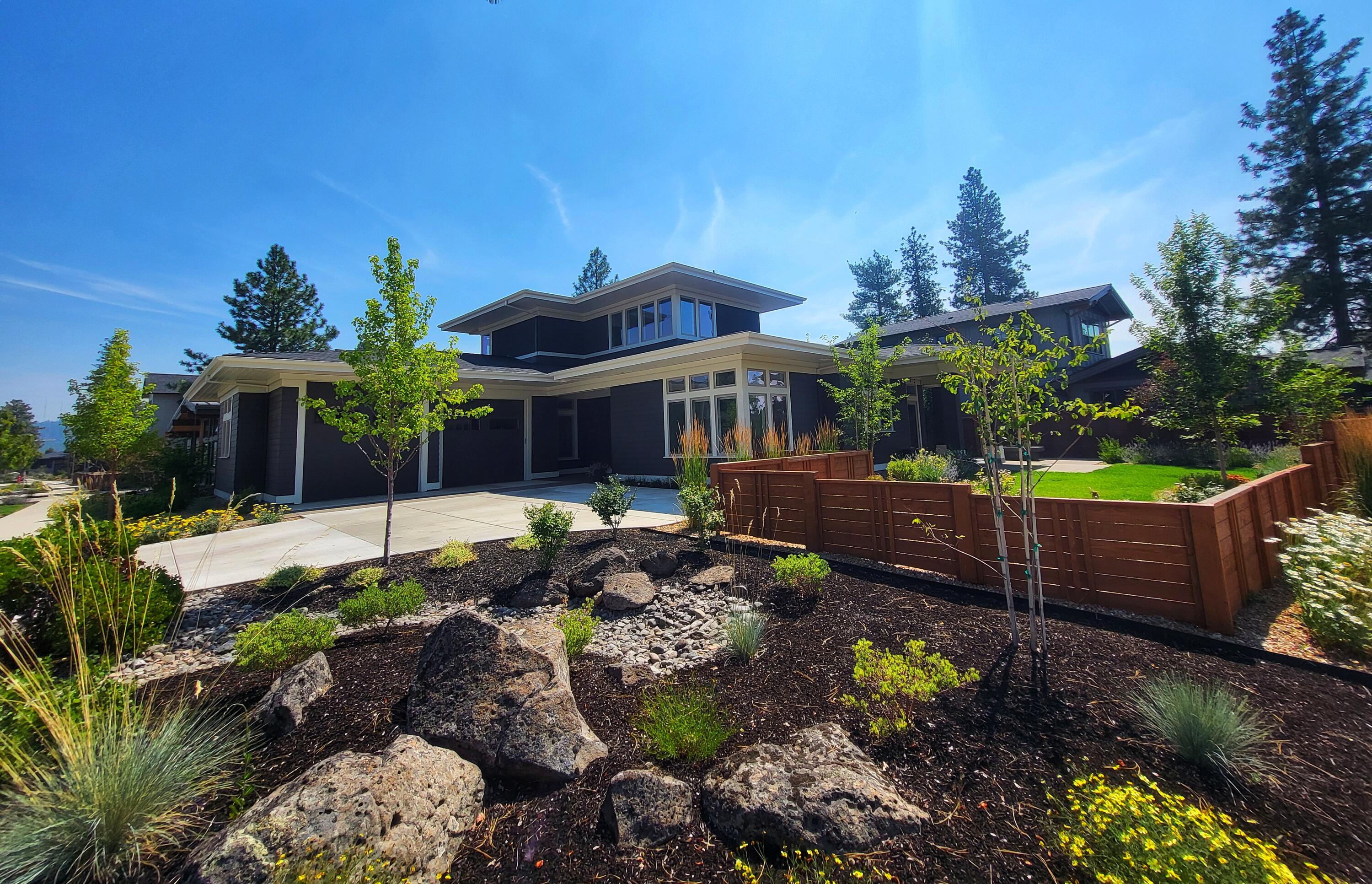 Discovery West on Bend's west side is perched above Northwest Crossing. Convenient to excellent schools, shopping, eateries, wine tasting, pubs & trails. Phil's trail system & more, literally right outside your door! Easy access to Mt. Bachelor &  adventures! Greg Welch, Earth Advantage build, completed 2022 is lightly lived in, shows like new with an outstanding floor plan & finishes. Main level owner's suite w/heated tile floors in spa-like bath & big walk-in closet. Main level office, great room w/gas fireplace, high ceilings, abundant windows for a light & airy, yet warm & inviting space. The kitchen is a chef's dream with a big center island, loads of solid quartz countertops, Dacor appliances & walk-in pantry.2 bedrooms & bonus room up. Epic sunsets from the covered patio w/gas firepit & gas BBQ hook-up. Terrific fenced yard w/lush landscape. 2 car garage w/ 10' door, epoxy floor, EV charger & storage system round out the perfection