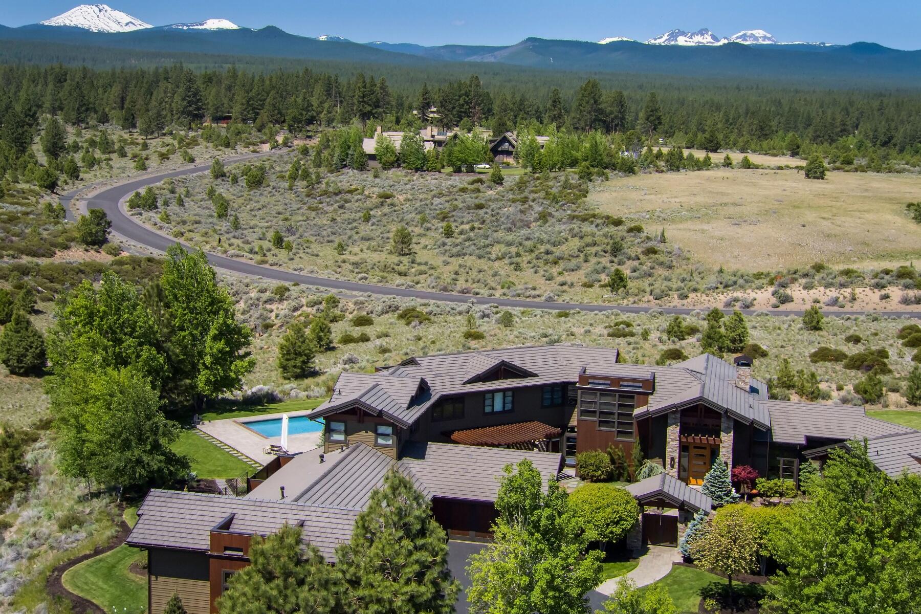Exceptional NW contemporary home, built by renowned Norman Building & Design, emanates quality workmanship. Designed to highlight the panoramic Cascade Mountain views, the home is sited on over 11 acres in The Highlands. Private courtyard entry features a water feature & Koi pond. Light filled great room with floor to ceiling stone fireplace & vaulted mahogany ceilings. Radiant heated Brazilian slate tiles extend throughout the main level. New hardwood flooring in the gym/bonus room & 3 upstairs bedroom suites. Well appointed kitchen boasts a large island, granite counters, quality appliances & custom light fixtures. Large 5-car garage, plus 35' RV garage; access to the sauna, fenced garden, & dog run. Wonderful outdoor living includes salt water swimming pool & hot tub, covered patio with fireplace & shade blinds, & upstairs deck. Peaceful, gated community adjacent to the National Forest & Phil's Trail complex, close to schools, golf, downtown Bend, & the road to Mt Bachelor.