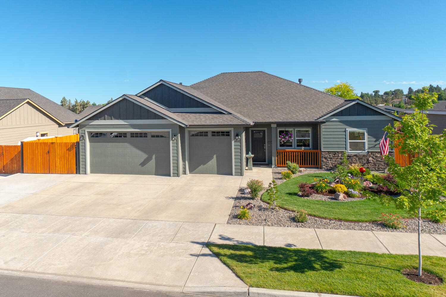 Don't miss! Located on the Bend side of Redmond w/Cascade Mtn Views. Spacious living both inside & out, w/plenty of room for entertaining. Vaulted Great Room plan w/open Kitchen, tons of cabinetry & prep space on the slab Quartz counters. Neat & tidy full height tiled back splash, SS appliances, & farm sink. Living space offers a cozy Gas burning fireplace w/stylish accents, top down bottom up cellular blinds,  & room for gathering. Desirable Primary separation, walk in closet, soaking corner tub, step in shower, tiled floors & dual vanities. 2 additional guest rooms w/full bath. Laundry room w/storage & folding table too! Durable wood look laminate flooring, carpet in the bedrooms & tiled baths. Gas forced air, A/C, solar tube & large covered back patio area. Triple car garage w/epoxy floors, 8x12 hickory shed, fully fenced, professionally landscaped w/auto sprinklers, RV Parking + 30amp power!