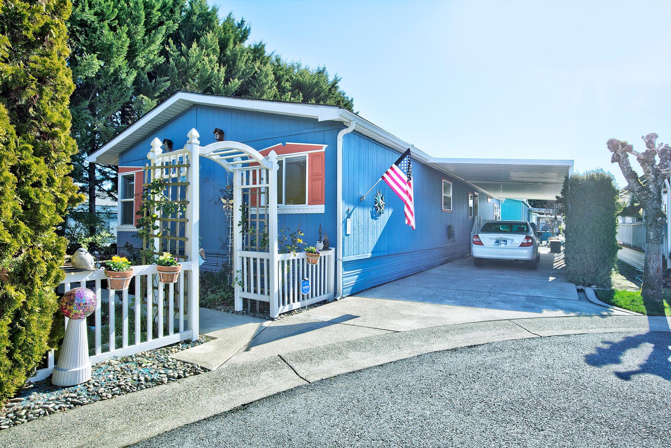 Meticulously maintained 1782 SF, 3bed, 2bath Manufactured Home w/split open floor plan that is tucked privately at end of cul-de-sac in Willow Estates S. 55+. Lg updated kitchen boasts newer appliances, eat-in island, wood cabinets, pull out shelving, lg skylight, and pantry. Upgraded laminate flooring in the living area w/plush carpet in the bdrms, vaulted ceilings w/plant shelves, woodstove, ceiling fans, vinyl windows, heat pump, & so much more. Spacious primary bdrm has dual walk-in closets & a lrg bathroom w/double vanity & oversized soaking tub. The ample 2nd & 3rd  bdrms each have walk-in closets. Enter through private landscaped yard equipped w/timed sprinklers & drip irrigation that leads to the lrg deck & frnt door or through the backdoor, off the triple length carport into the laundry rm/ office/craft area.  This home w/ a 4-year-old roof & newer exterior paint includes a 6x20ft workshop/storage shed equipped w/power & raised garden beds. This beautiful home is move-in ready