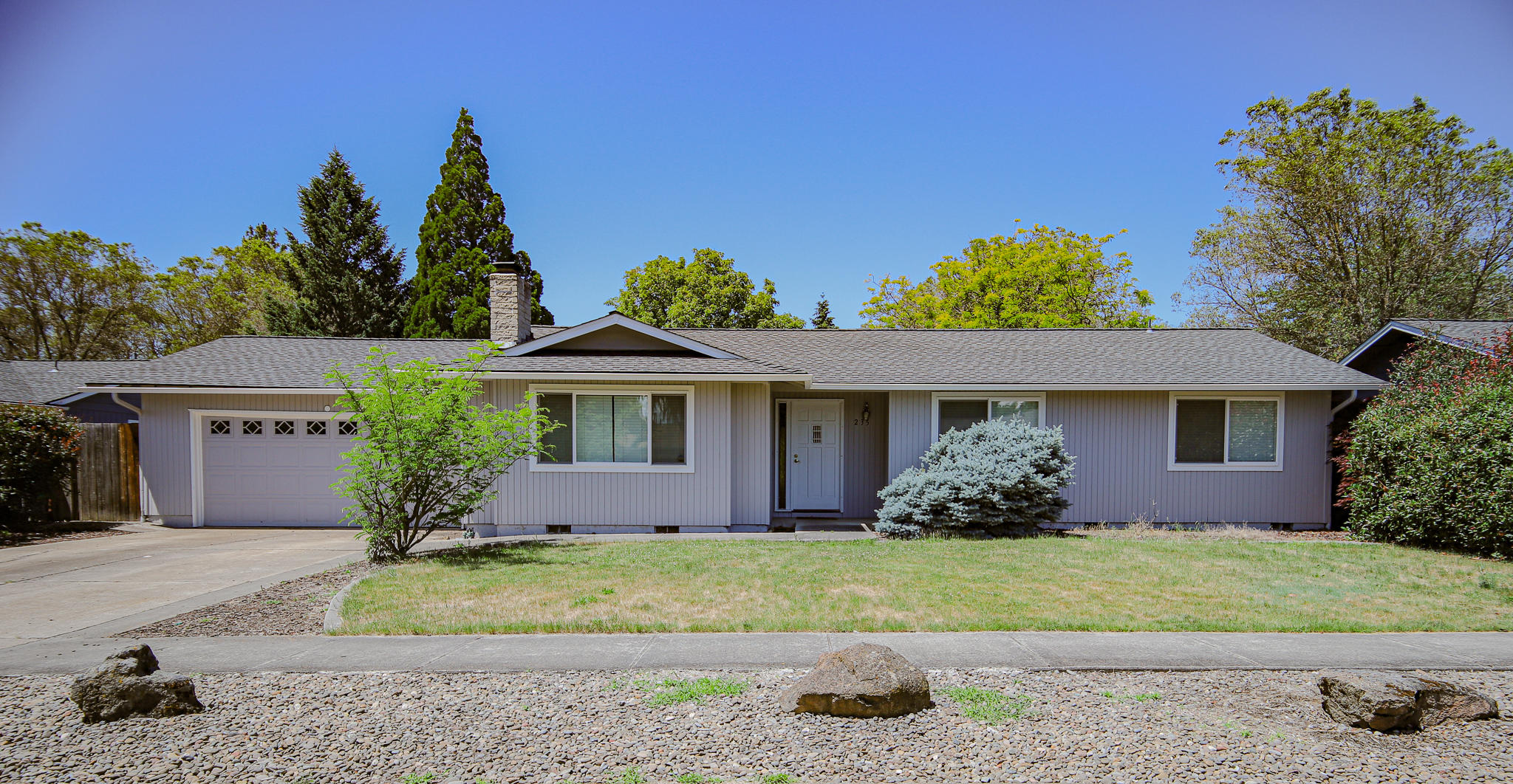Charming home situated in a perfect location of Eagle Point's desirable tree lined streets. Home has been well maintained with the exterior being painted within the past 6 months. Ranch style home features a wood burning fireplace for that cozy feeling, huge backyard, low maintenance, inground sprinkler system with covered patio for some great outdoor fun and a 2 car garage for parking and/or storage space. Close to schools, shopping, parks and much more. Perfect home for that first time home buyer or investor.