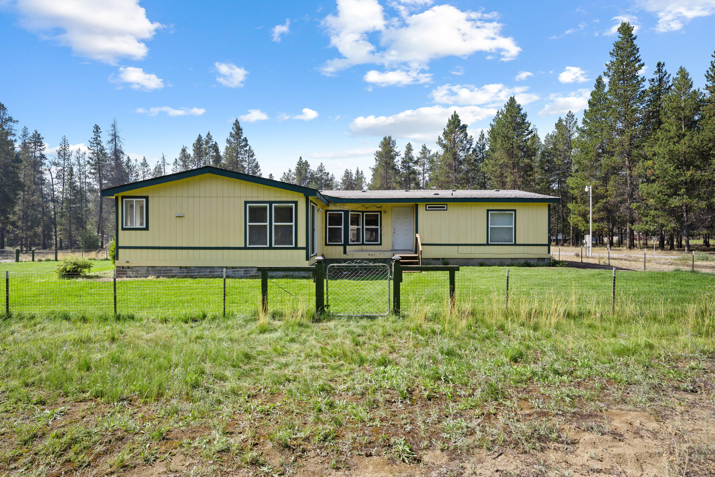 Looking for extra space! This is it with this charming, sunlit country home on 2 acres in La Pine.
Nestled on a beautifully maintained lot just minutes from La Pine State Park, this 1997 4-bedroom, 2-bath residence offers comfortable living with plenty of space to spread
out. Boasting 1,928 square feet of thoughtfully laid-out living area, the home enjoys abundant natural light and an inviting, open feel.
Key features:
Four bedrooms and two baths across a well-flowing floor plan, with primary separation. 
Bright, airy interiors with generous natural light throughout. 
1,928 sq ft of living space on a meticulously cared-for property
Expansive 2-acre lot providing privacy and outdoor potential
Large 1,440 sq ft shop with a concrete floor—perfect for hobbies, storage, or a workshop
Prime location near outdoor recreation, including La Pine State Park and surrounding trails.