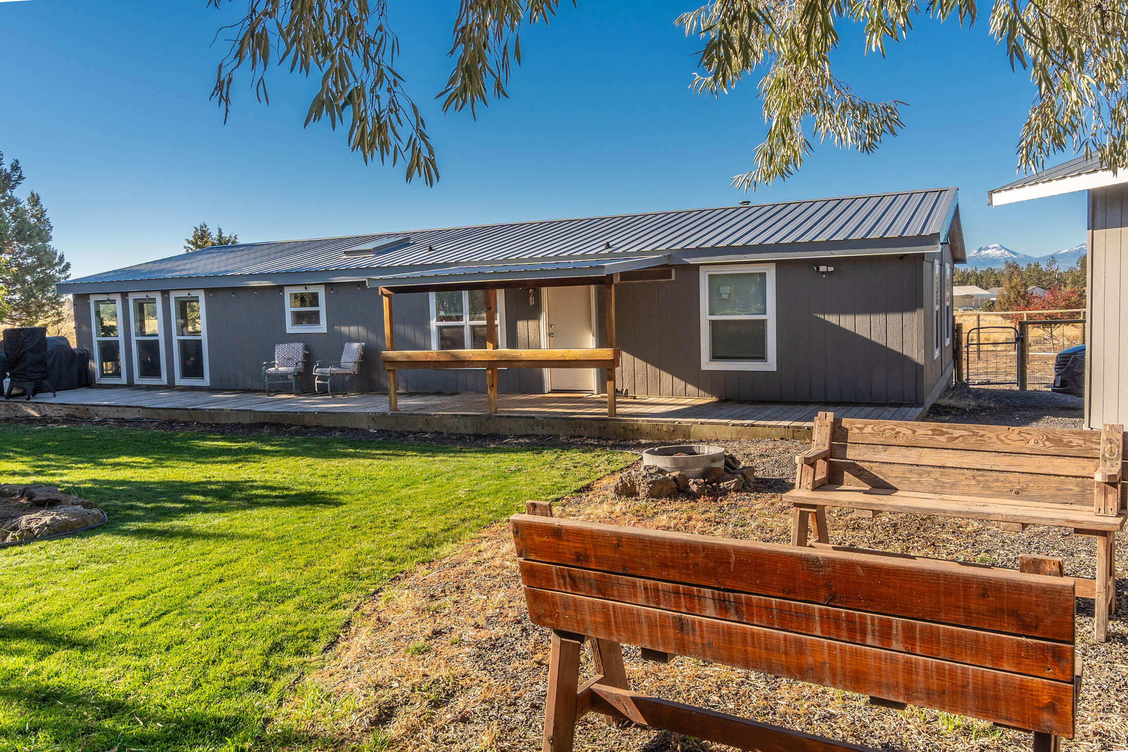 Private, well maintained and updated manufactured home on over an acre in Crooked River Ranch.  Unobstructed cascade mountain views and backing to 85 acres of community common space make for a serene setting.  Large detached 2 car garage and ample parking for all of your toys.  Come check out this property today.