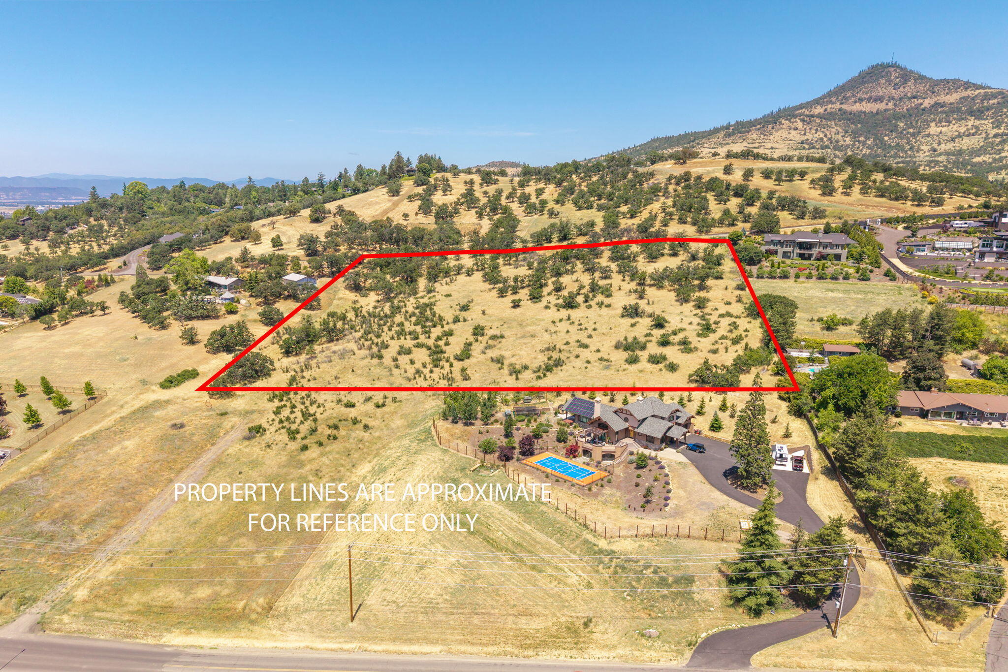 Panoramic views of the Rogue Valley!  A picturesque setting of country, city, and mountain views. This gently sloping 6.54-acre property located in an upscale East Medford neighborhood is the perfect place to build your dream home.  Plenty of room for your home, an ADU, a swimming pool, a solar system, garden, septic system, well, and maybe even a vineyard.  (Buyer should perform their own due diligence into the allowable uses.)  .  Enjoy the city lights relaxing on your patio!   Minutes by car to grocery shopping, restaurants, coffee shops, physical fitness facilities, golf, top-tier medical facilities, wineries, and the RV Country Club.  Seller will consider seller financing.