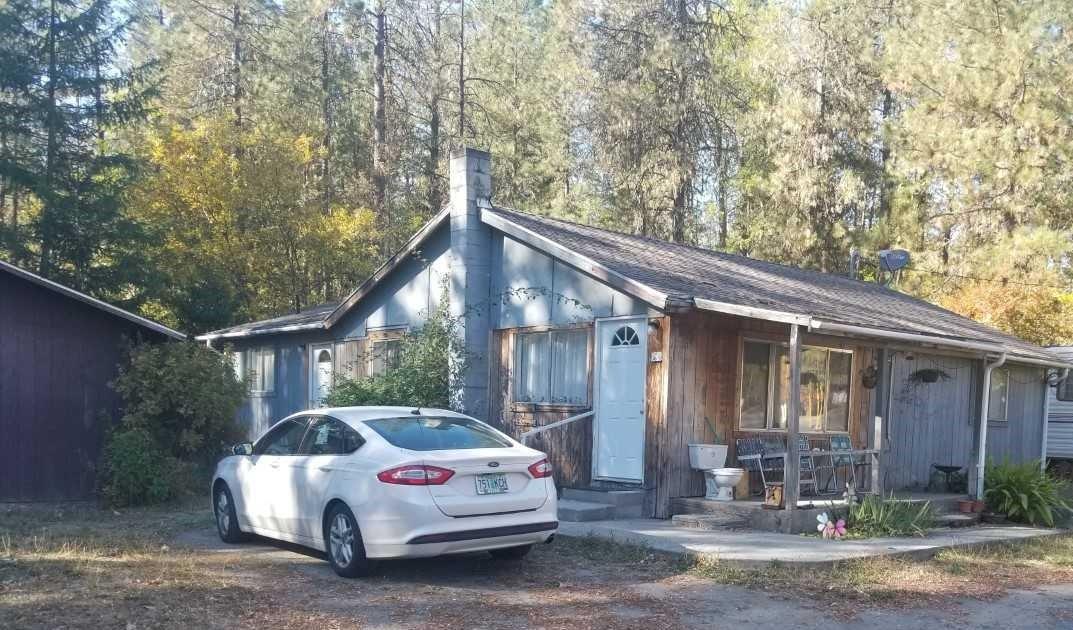 This is your opportunity to own a beautiful piece of Southern Oregon land!Level 1.95 acres with native trees and shrubs. The two-bedroom, one-bath fixer home is completely livable and will be adorable with your loving touches. The detached garage is perfect for your projects. In the country but not too far from town. May qualify for a rehab loan. Call for your personal showing today!