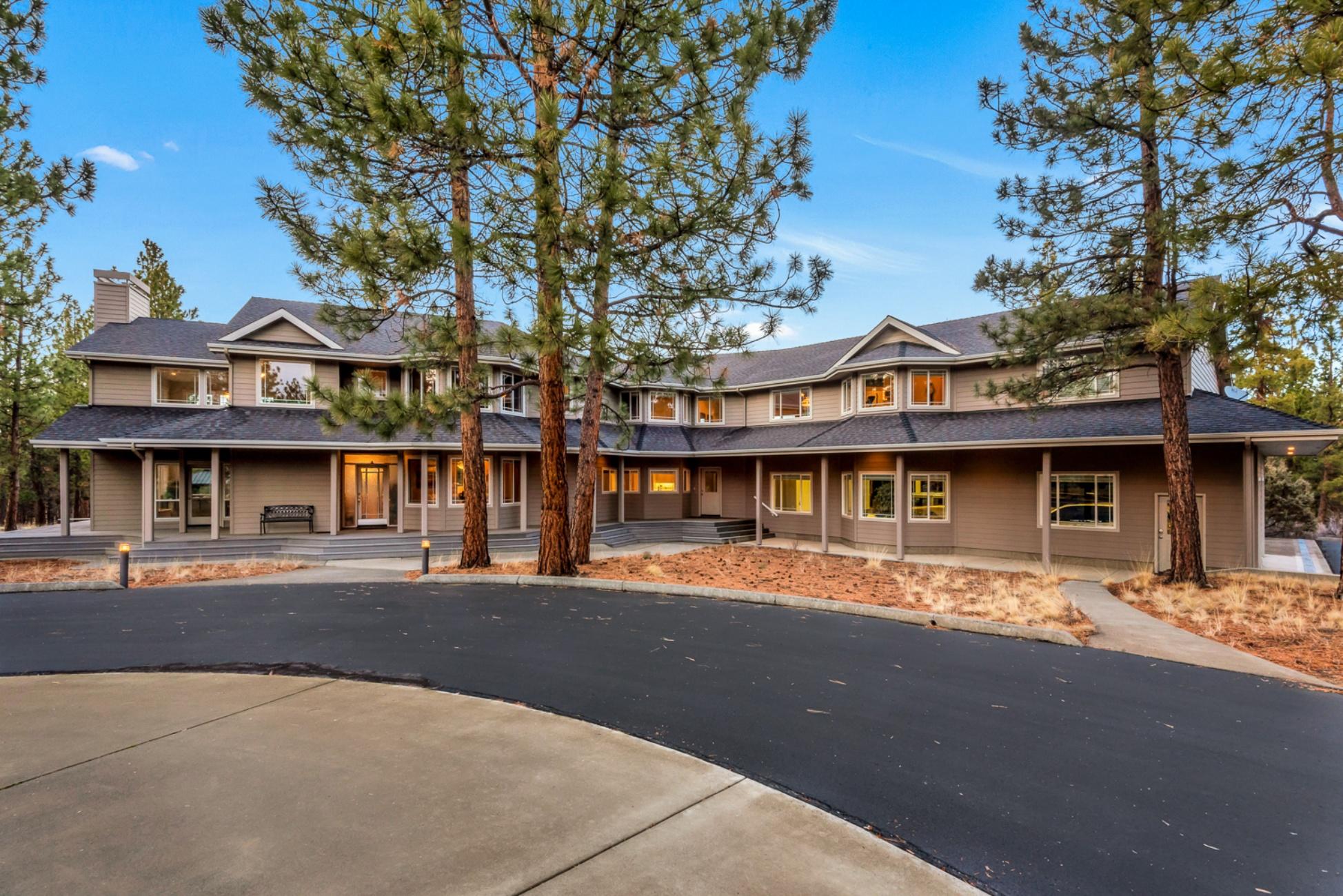 Experience serenity on nearly 20 acres in the heart of Central Oregon. This property features an immaculately preserved custom built home with a private tennis court. With more than 5,600 SqFt of living space, 4 bd, 3 full bath, 3 1/2 baths and an attached 2,343 SqFt garage that is a car enthusiast's dream. The garage is heating with RV parking, four parking spaces, a shop area with a private 1/2 bath. The master suite is located on the main level and includes a fireplace, walk-in shower, jetted tub and walk-in closet. The main living room features a vaulted ceiling and amazing windows that bring in the natural light and views of the towering pines that populate the property. Enjoy Cascade Mountains views from the second level deck which adjoins 2 bdrms. Upstairs also includes a 4th bdrm, a bunk room, game room, private office, and a 9-seat home theatre that is perfectly set up for endless entertainment for all ages. This is a must-see property to truly appreciate all it has to offer.
