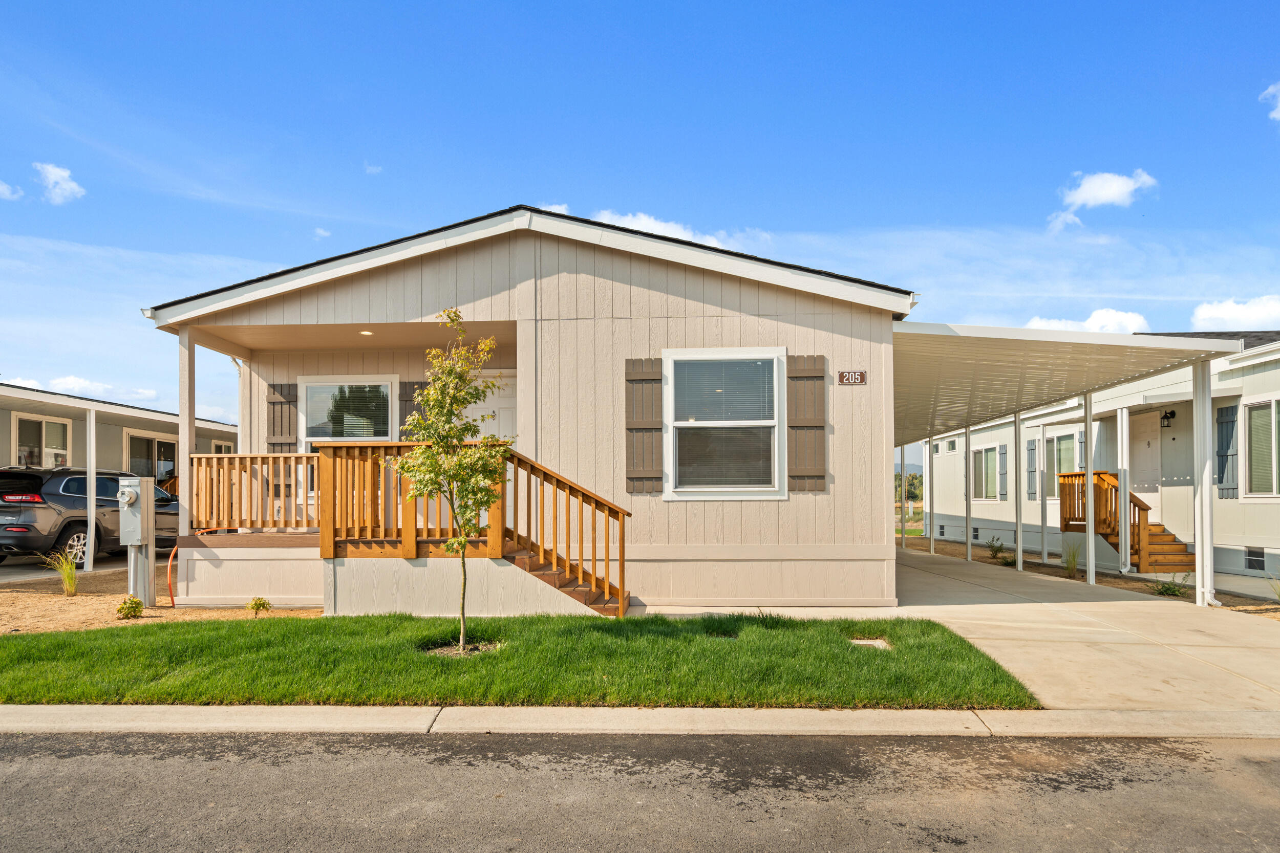 Welcome to unit #205 located in the new and immaculately improved Oak Ridge Estates community! This 3-bedroom 2-bath manufactured home has it all. Spacious open floor plan with an amazing well appointed kitchen. Stainless Steel appliance package includes, Gas Stove, 25CU ft Fridge with Ice and Water in the Door, Built in Microwave, and Dishwasher, Laundry Room with Gas Hookups, Landscaped front and back with auto sprinkler system. Both guest bedrooms are perfectly sized and the primary bedroom has a walk in closet and an enormous bathroom. This family-friendly kid approved park, provides access to beautifully landscaped common areas, walking paths, and incredible amenities including a pool, spa, clubhouse, state of the art fitness center and playground. With easy access to nearby shopping, dining, and the 5 Freeway, this home combines the best of peaceful living and affordability Come see this incredible value located in an updated pet-friendly park before it's too late!