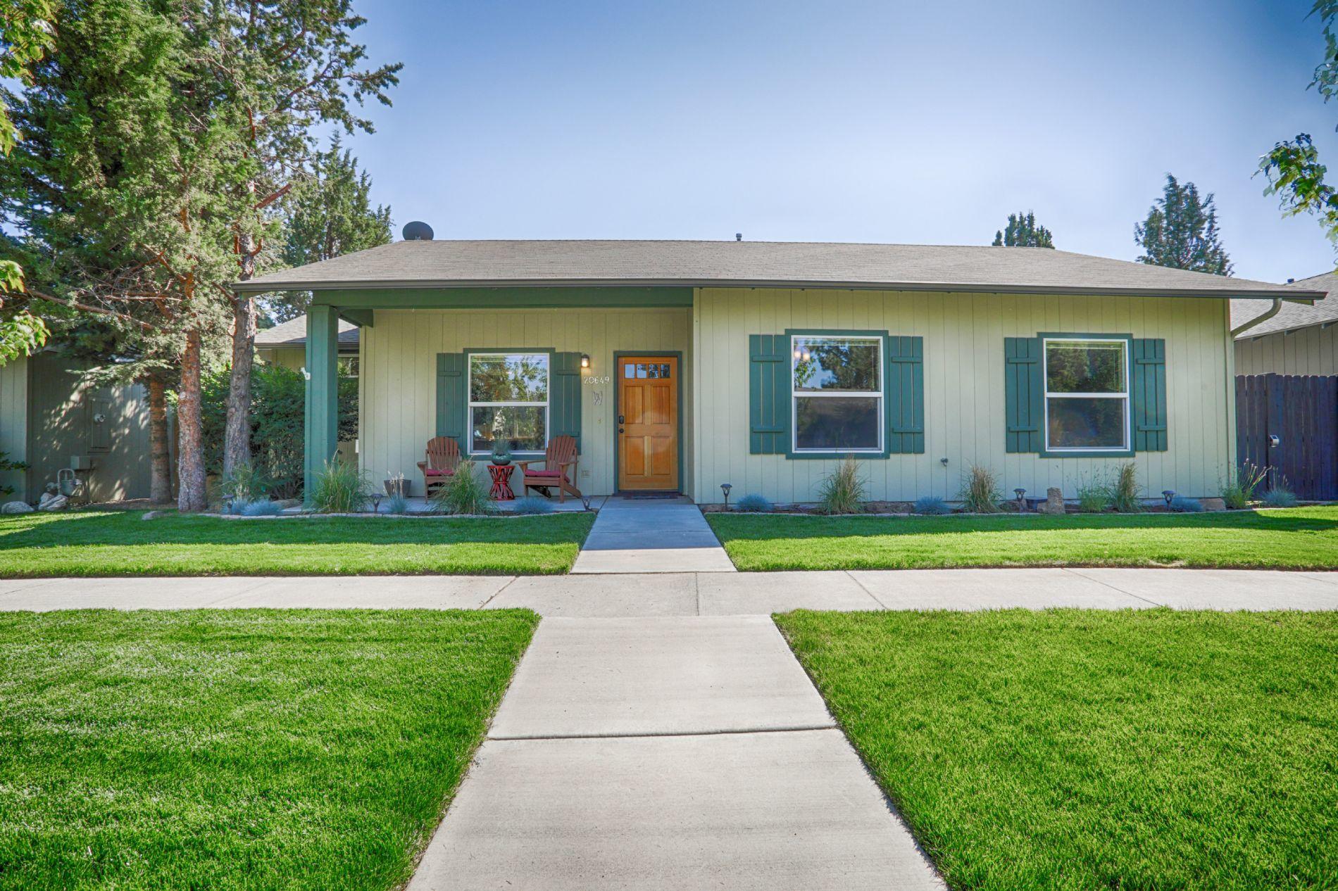 Stunning single level home in SE Bend includes remodeled kitchen with expanded island, tile counters/flooring, S/S appliances, and 5
burner gas range. This unique home includes a 100 sq foot office addition built in 2018. Master bathroom was completely remodeled to add an
additional sink, skylight, new cabinets, new sinks, new tiled shower, new fixtures, new toilet, & tiled counter/flooring. This magnificent home has solid
hardwood flooring throughout living, office, formal dining, and hallway. The dining room can be converted to a 3rd bedroom by adding doors/closet. Gas fireplace, slate entry, and newer plush carpeting in both bedrooms. Guest bathroom updated to include new sink, new fixtures, and new toilet. Another wonderful feature of this home is the 2 car over-sized alley facing garage that checks in at 576 sq feet. Front/backyard landscaping completely renovated to include new sod with paver border, new plants, new irrigation, and new rear privacy fencing.
