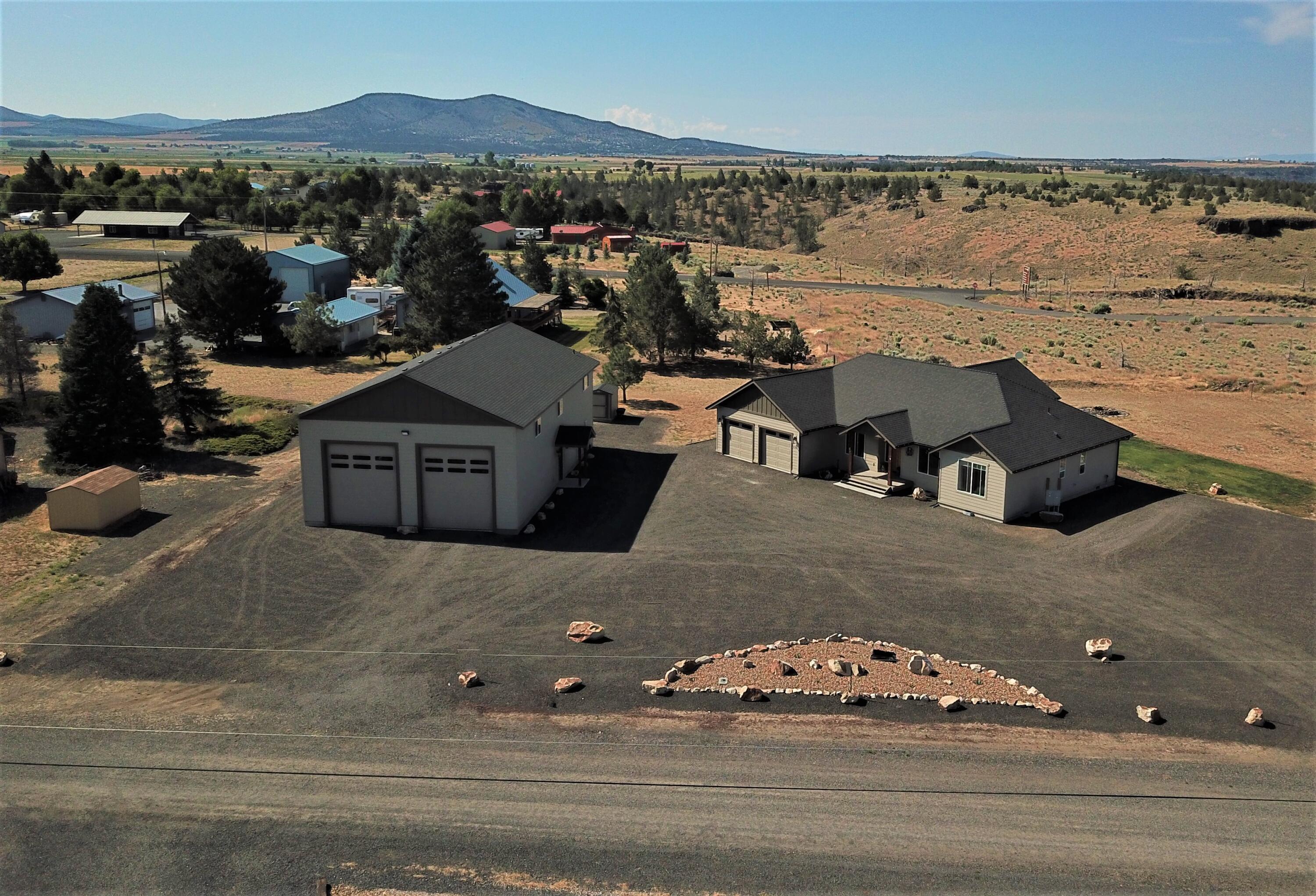 Exceptional 1 acre custom-built home w/expansive & unobstructed Cascade Mtn. views located at the entrance of Lake Billy Chinook & Cove Palisades State Park.  This 2107 sf home has 3 B/R, 3 Full Baths  Knotty Alder custom solid wood cabinets, doors & trim throughout. Open concept w/one-of-a-kind stacked stone propane fireplace w/raw edge solid juniper mantel. Chef's kitchen w/all the amenities a fine kitchen should have plus island to seat 6+. Primary suite boasts 4 pc.bath, walk-in closet, oversized sleeping area
w/walk-out slider to private deck. 2 additional bedrooms plus hall bath & flex room---
office/craft/reading---make it your own. Front & rear porches are covered, & back deck has privacy half walls. The bonus is a 36' X 60' custom shop, fully insulated walls & ceiling, w/3pc. bath. Upstairs bonus/flex room, RV parking w/hook-ups, with 2 12'x14' roll-up doors & 1 9'x8' roll up door, workbench lots of storage AND so much
more. See Amenities Sheet on back of flyer or in docs