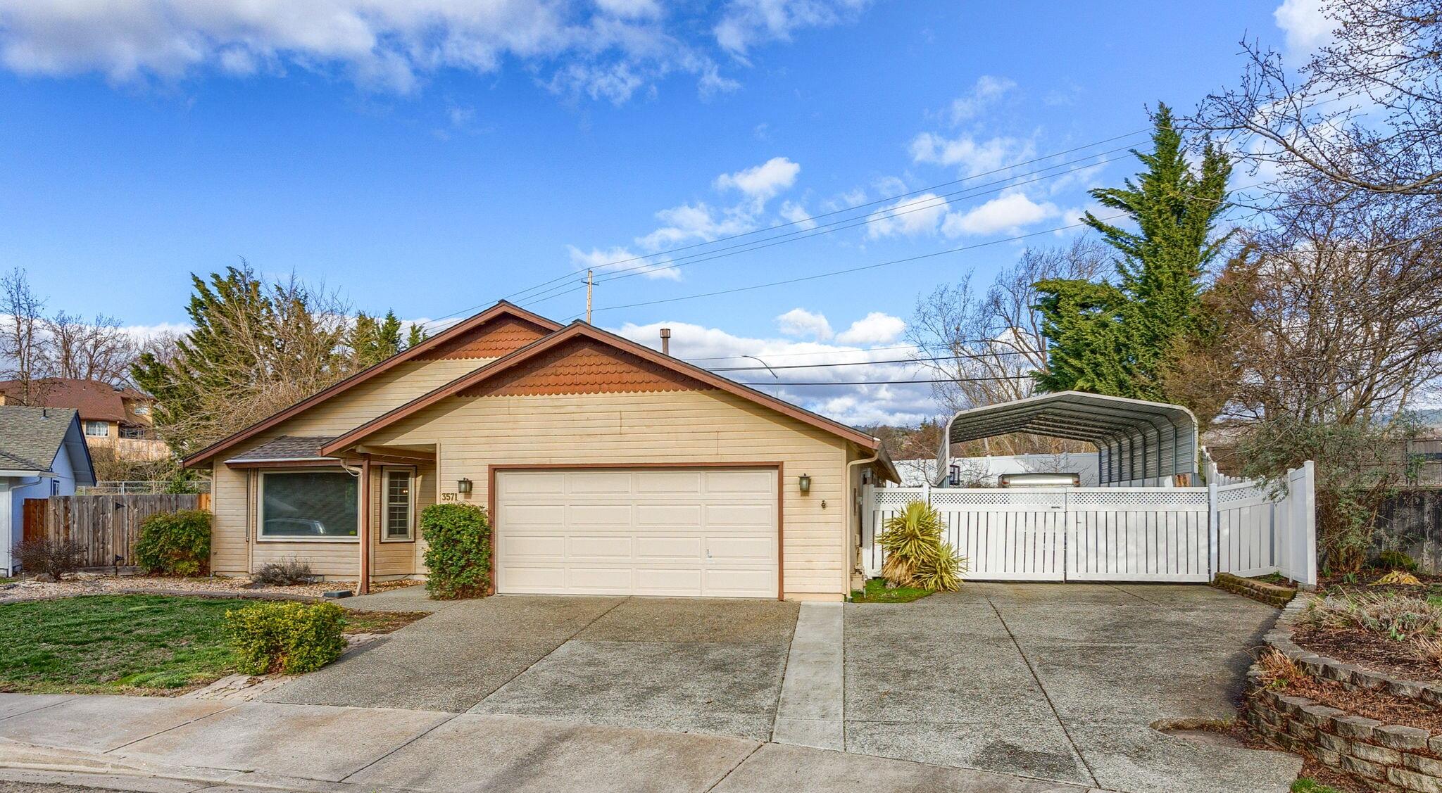 This beautifully updated 3-bedroom, 2-bath home sits on a generous 0.34-acre lot in a prime location! The remodeled kitchen features granite countertops and brand-new stainless steel appliances. Enjoy peace of mind with a new HVAC system, new hot water heater, and all-new flooring, including plush carpet and stylish laminate. The oversized garage provides ample storage, while the covered RV parking with hookups makes this home perfect for adventurers. Don't miss this opportunity—schedule your showing today!