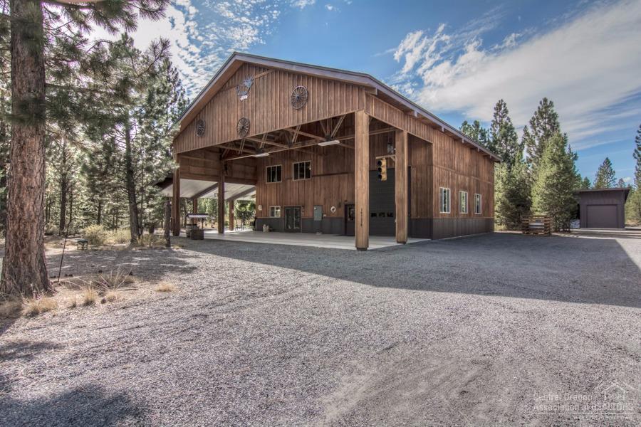 Escape to the seclusion and beauty of this 5.09 acre wilderness retreat. Beautifully constructed with the outdoors family in mind, plenty of storage and a 1200 sqft attached shop with large carport with room for all your toys. Home has spacious great room featuring a stunning propane fireplace with attached dining area. Kitchen features stainless steel appliances, birch cabinets and high ceilings. Master on main with jetted tub & upstairs has expansive bonus room perfect for housing guests on ski retreat.