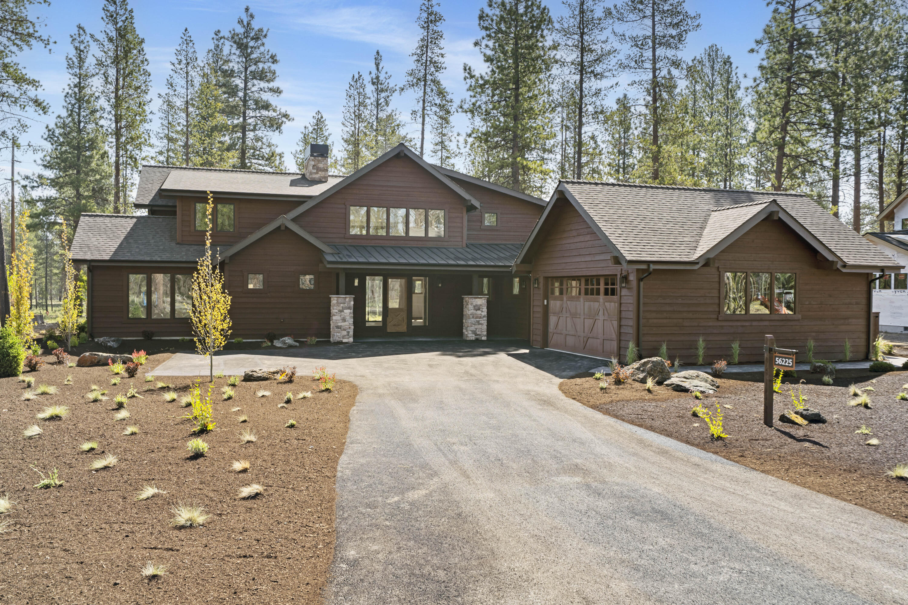 Embrace the perfect blend of style, sophistication and function in this new home by Stone Bridge Homes in Central Oregon's premier resort community, Caldera Springs.  This thoughtfully designed floorplan brings the kitchen, great room and dedicated dining into a cohesive and inviting space. The kitchen features select Jenn Air appliances, quartz island, white oak floor and knotty alder cabinetry, bringing a warm and modern touch. Offering the primary suite and an additional secondary suite on the main level, along with a dedicated upstairs suite. Two additional rooms upstairs offer the perfect setup for a bunk room, bonus room, or additional guest space. Enjoy the east-facing covered outdoor living in a serene setting backing to common space. Ideally designed for a luxurious vacation retreat or everyday living. Make everyday feel like a getaway in Caldera Springs with access to Forest House, Lake House, The Quarry, 9-hole golf pickleball, tennis and more.