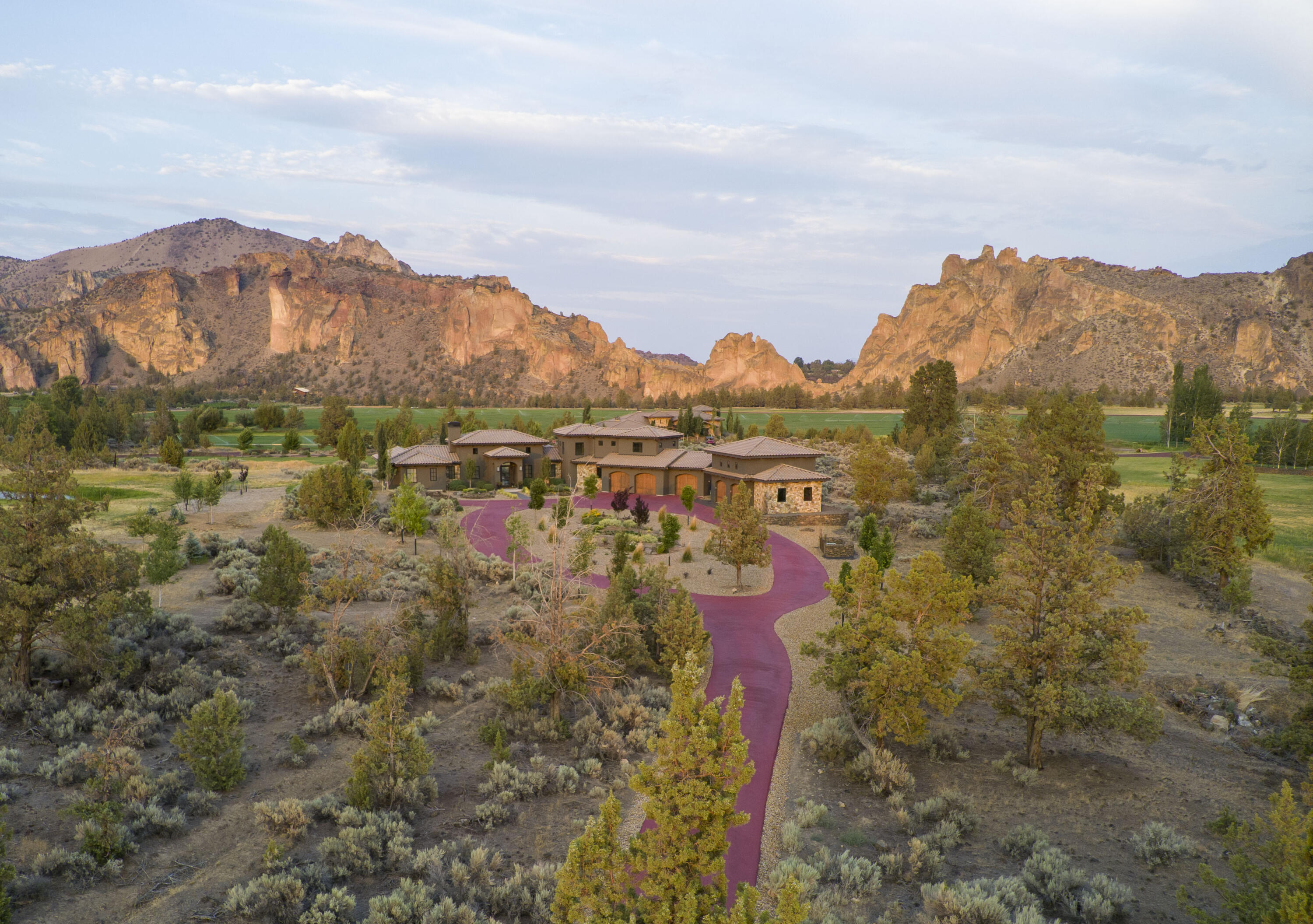 This Ranch at the Canyons home features majestic Smith Rock views and chic design in every room. It's rare to find a home and shop of this caliber with amenities like the Clubhouse with fitness center, pool & guest suites;  event venue; equestrian center; miles of trails, fly fishing & more. The home's stylish design features a vaulted great room with textured floor-to-ceiling fireplace, abundant windows to take in the views, designer kitchen with steel backsplash, and luxury primary suite & office on the main floor. Additional bedrooms upstairs enjoy the views and separation from the main living space. There's room for your toys in the 3-car attached garage, plus a new heated shop with douglas fir flooring, work shop and fly fishing table, storage room and continued stylish design. All furnishings are negotiable outside of escrow. There is simply no comparison to this sexy chic style, and no better place to live than the Ranch at the Canyons.