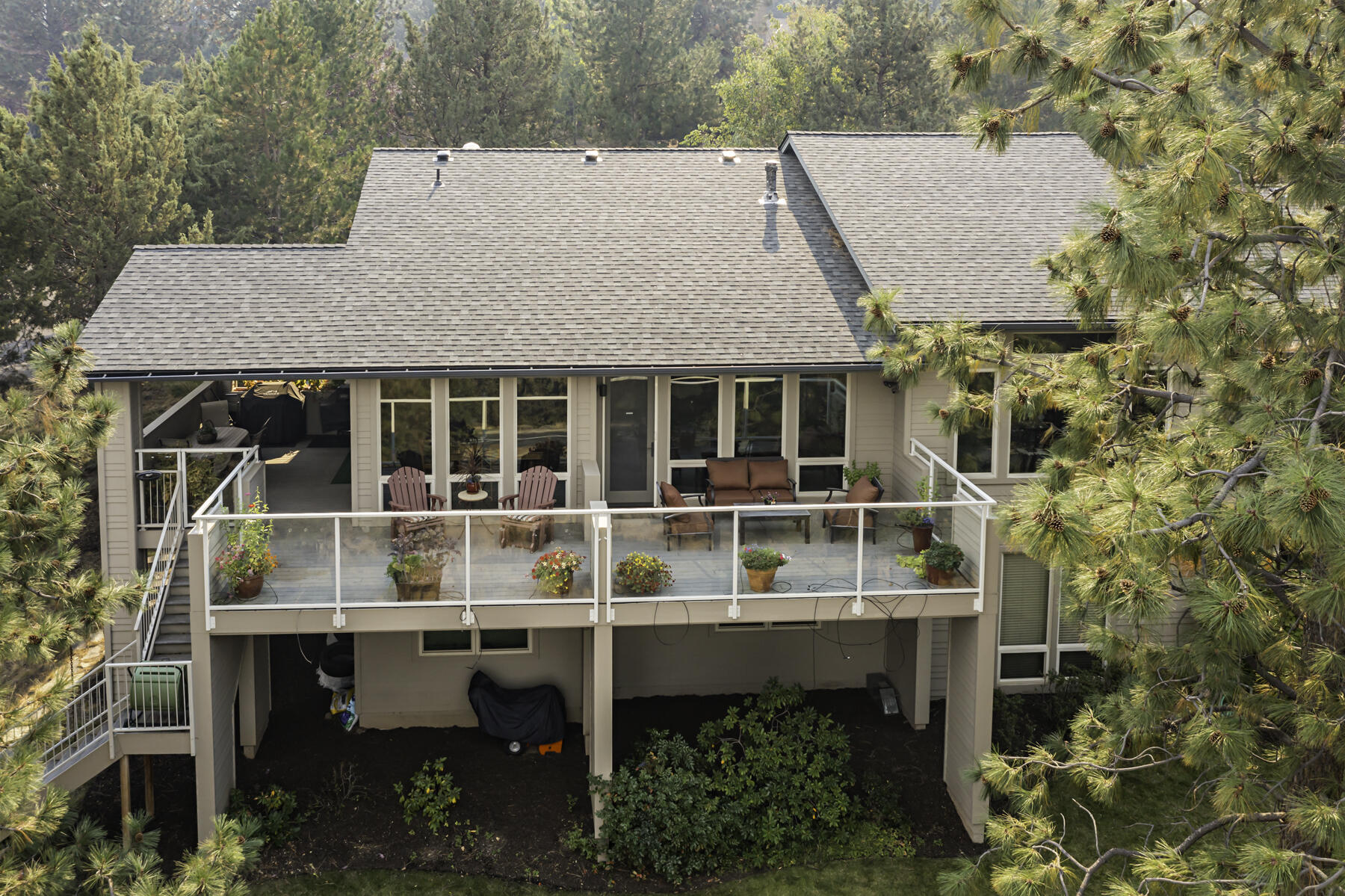 Breathtaking Cascade Mountain views frame this meticulously maintained, custom-crafted home on Awbrey Butte in NW Bend. Designed for high efficiency and comfort, it features radiant heat, eco-friendly solar panels, and countless upgrades—all priced well below replacement cost. The expansive great room showcases vaulted ceilings, a cozy gas fireplace, and built-ins that extends to the chef's gourmet island kitchen with granite countertops, stainless appliances, and a sunlit dining area. The spacious main level primary suite offers a luxurious private bath with jetted tub, tiled shower, and walk-in closet. A private study with elegant built-ins adds both charm and convenience. The lower level includes a versatile bonus room & a sun-soaked sunroom perfect for hobbies and relaxation. Enjoy the serene .87-acre setting with mature landscaping, towering pines, and an extensive main level deck ideal for outdoor living and unwinding after a long day. Call your broker for a personal tour today.