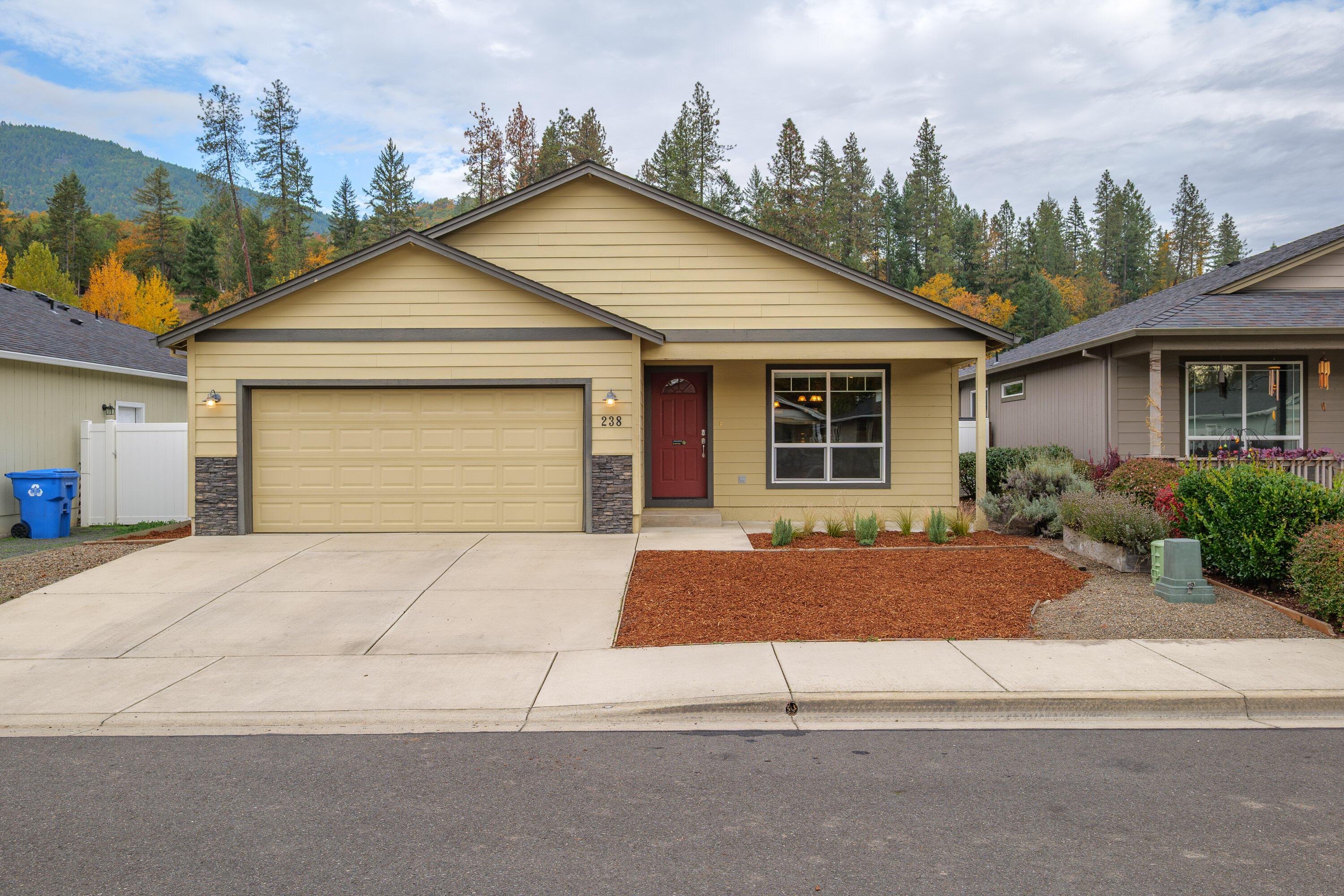 Built in 2016, this beautifully maintained 2-bedroom, 2-bath home offers 1,148 sq ft of comfortable single-level living. Step inside to find vaulted ceilings, wood-style floors, and natural light that enhance the open-concept design. The spacious kitchen features granite countertops, a large island, stainless steel appliances, and warm cabinetry—perfect for everyday living or entertaining. Both bedrooms include walk-in closets, and the primary suite adds a private bath with granite finishes and a walk-in shower. Enjoy year-round comfort with efficient systems and modern touches throughout. Step outside to a covered back patio and low-maintenance fenced yard, ideal for relaxing or container gardening. The attached garage adds convenience and storage, all in a neighborhood close to town amenities. Move-in ready and easy to love!