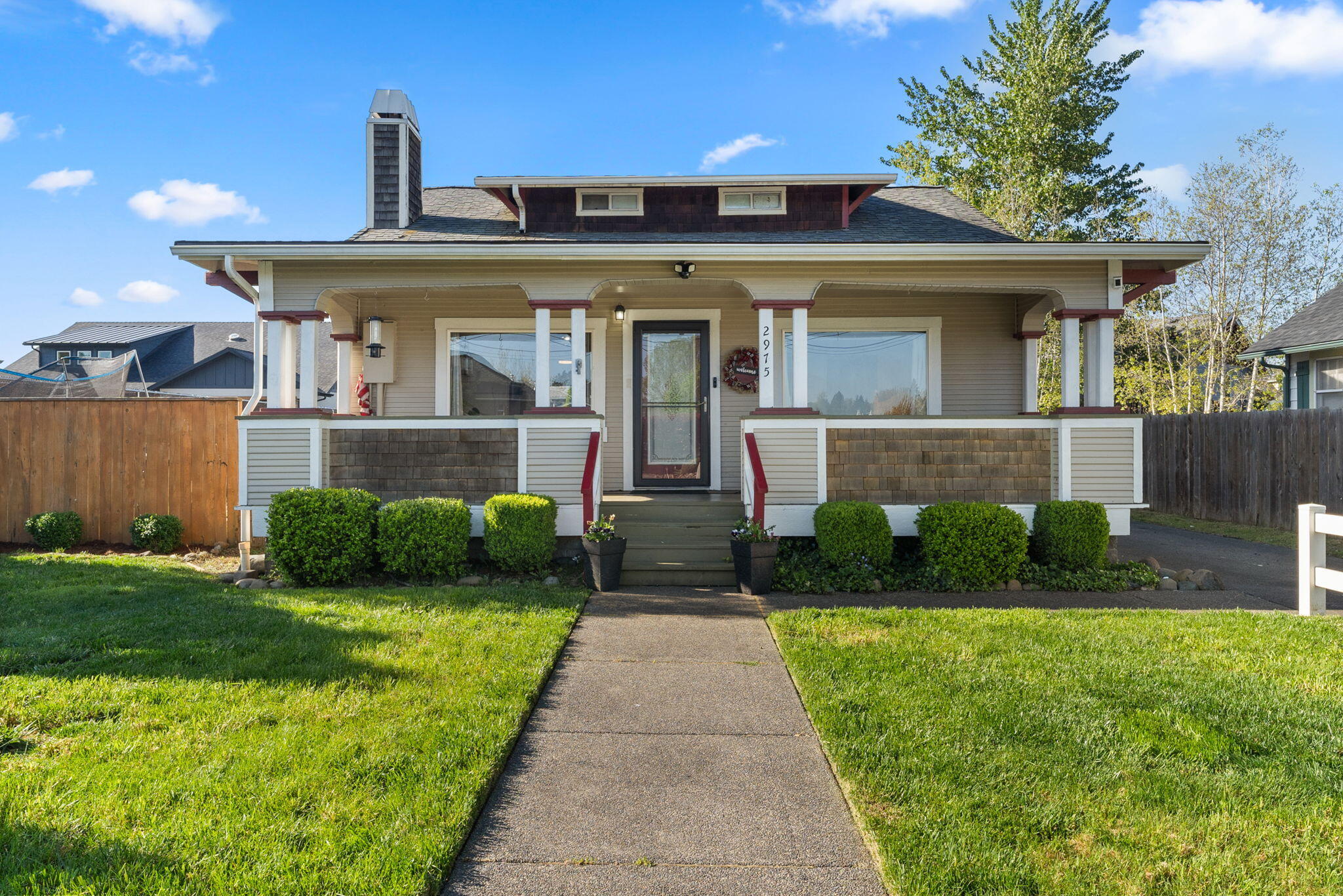 $2,500 Buyer Incentive! Motivated Seller Relocating so don't miss this one! Step into the timeless elegance of this beautifully updated 1926 Craftsman. Nestled on a generous 0.23-acre lot in Southwest Grants Pass, this inviting 4-bedroom, 1-bath home offers just under 1,600 sq ft of light-filled living space. The updated kitchen boasts butcher block counters and stainless steel appliances, blending modern style with classic charm. The gas fireplace in the living room creates a cozy atmosphere, perfect for relaxing on cooler evenings. The flexible upstairs area functions as a bedroom, office, or playroom. Outside, the fenced backyard is a private retreat, ideal for pets and gardening with RV parking and drive-through gate. Enjoy morning coffee on the front porch, where you can soak in the tranquility. With city utilities, excellent schools, and a peaceful, country atmosphere, this Craftsman gem offers the best of all worlds. Come tour and take advantage of the $2,500 Buyer Credit!