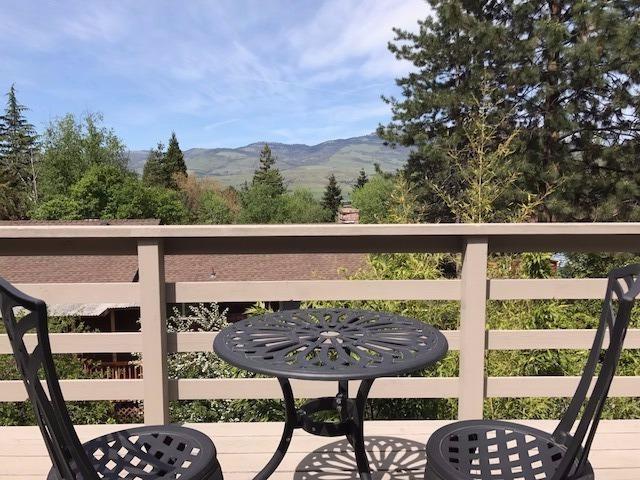 Location, location, location! The views are awesome from this magnificent three bedroom two bath Ashland home located above the boulevard. The primary access for the house is on Friendship. Easy access to downtown shopping and Oregon Shakespeare plays! This contemporary home has a gorgeous master bedroom that flows into the living area and has easy access to the large deck which offers breathtaking views. There are two outbuildings so you can garden and have a greenhouse! There are producing fig and cherry trees. Vaulted ceilings, granite and tile, brick fireplace and a huge master suite are only a few of the fantastic features! The home has been well cared for, has fresh paint, clean carpets and represents great value. Finished 2 car garage with lots of storage.