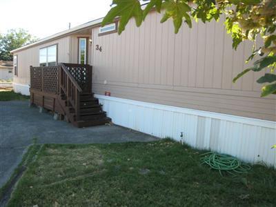 On a large cul-de-sac lot. This home has vaulted ceilings in huge living room, dining area, open to a bright kitchen with it's many cabinets, walk-in pantry and ample counter space with breakfast bar. Huge bedrooms, master has Garden tub, shower, twin vanities and walk-in. New heat pump and New Washer & Dryer in 09. Park fee includes, water, sewer, garbage, basic cable and great club house with pool.