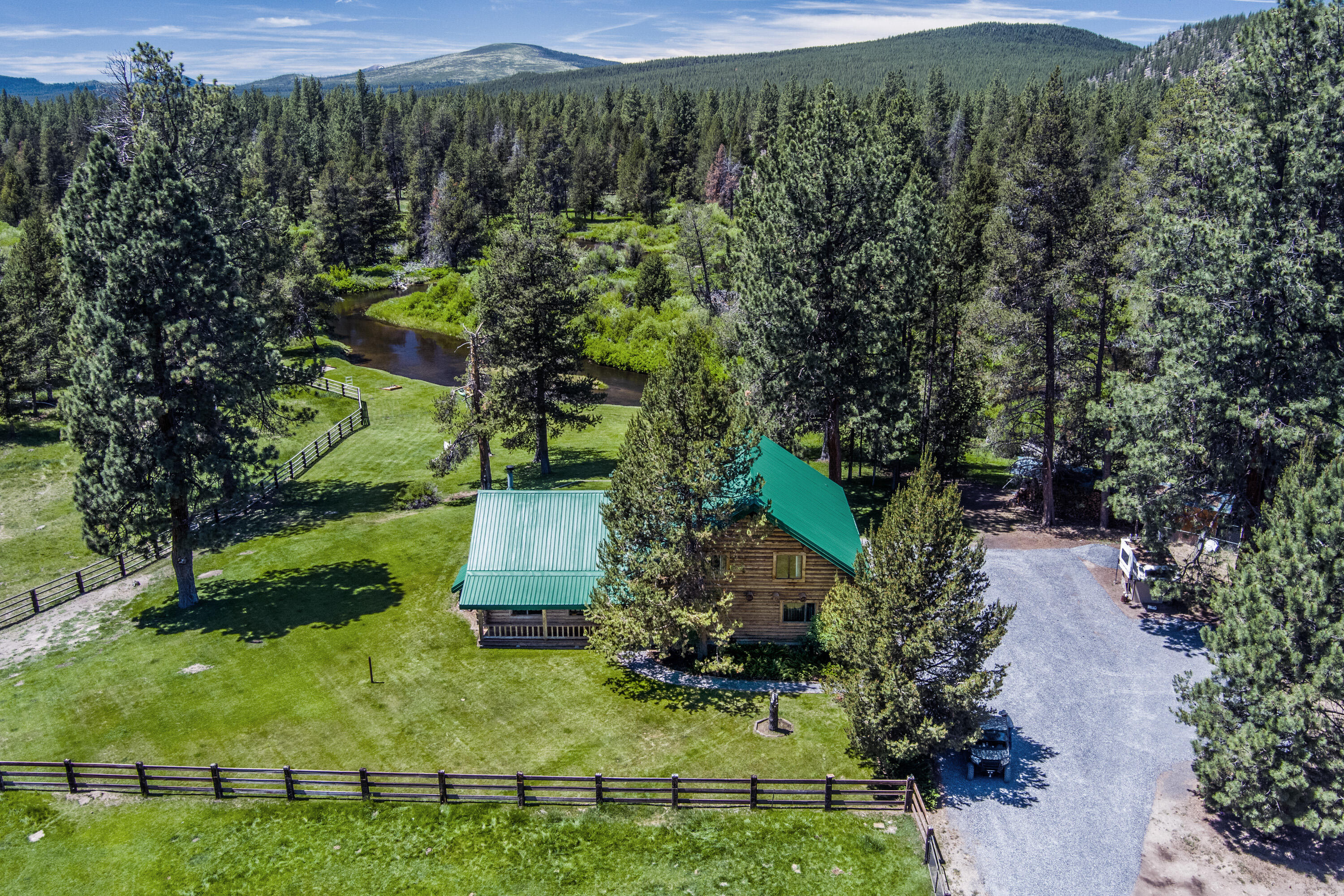 Live the Central Oregon quintessential lifestyle. Here is your opportunity to own an artesian, hand scribed, Log home nested on the picturesque banks of the Little Deschutes River. Spend your days bird and animal watching, hawks, beaver, otter, elk, and deer to name a few. Fish for brown trout from the riverbank. An outdoor activity for every generation of the family. The interior offers a large expansive living room, high vaulted ceilings with a wood burning stove to gather around. Master bedroom with bath on the main floor. 2nd level hosts another family room area with a billiards table, plus two additional guest bedrooms and bath. The kitchen offers easy access to the large wood deck for your memory making, social gatherings. Then top it off and enjoy a relaxing soak under the stars in the new hot tub. Wagon Trail Ranch offers clubhouse, seasonal heated swimming pool, trails, road maintenance, snow plowing and recently awarded Firewise Certification.