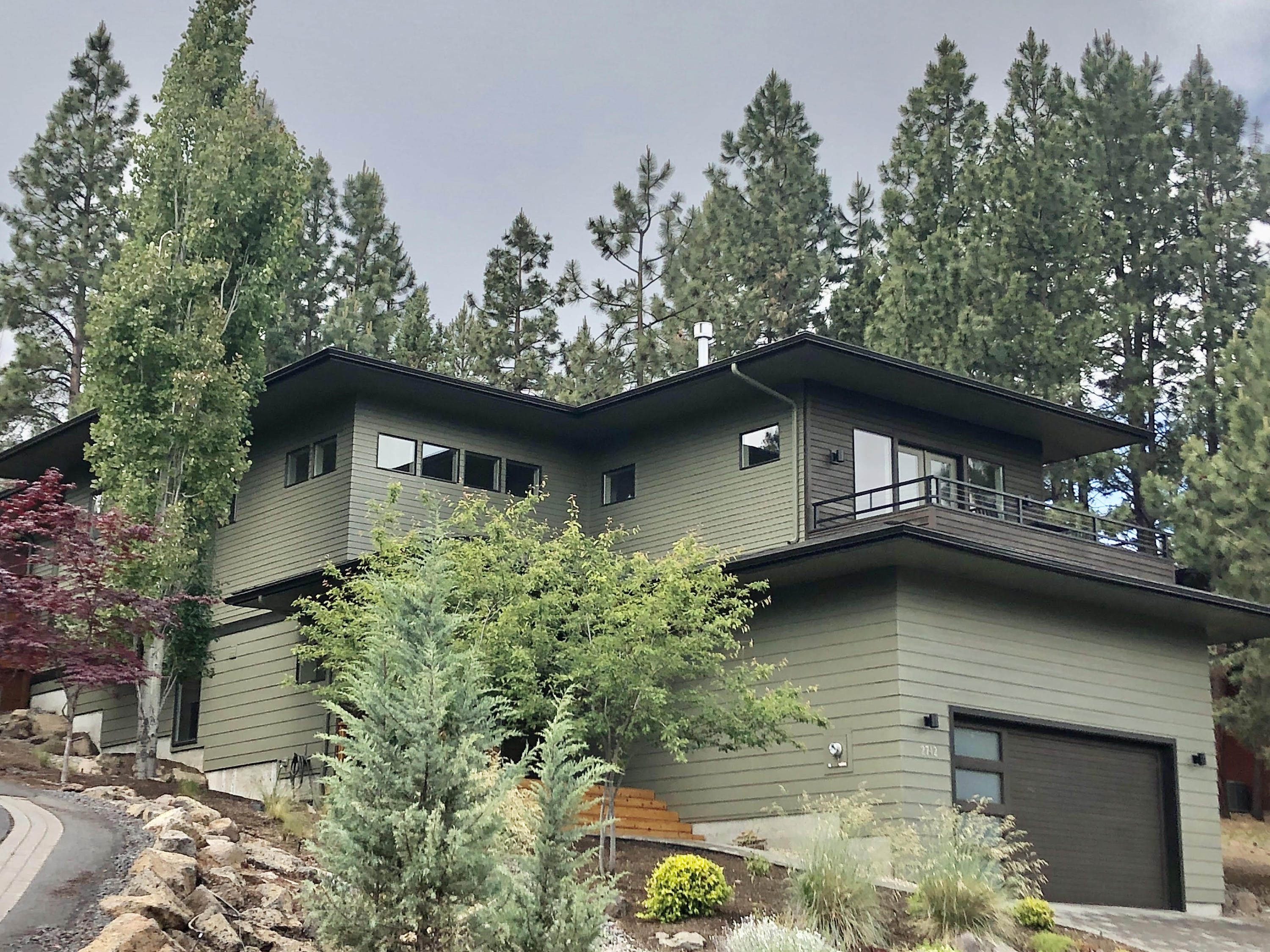 Coming soon!  Gorgeous, contemporary custom home with mountain views and the perfect westside location!  Walk to COCC. 
 Open concept, modern, high-end finishes.  Entry is stunning with soaring two-story high ceilings! Reverse living...2 nice bedrooms with media room, laundry room and full bath on lower level.  Upstairs has great room concept dining, living room, and master bedroom with ensuite. Beautiful mountain and treetop views, lots of natural light!  Acacia solid hardwood flooring, floor to ceiling fireplace with built-ins on either side, deck off living room takes in the peaceful surroundings and views.  Back yard is expansive, flat and usable space for enjoyment and entertaining.  Custom woodwork hot tub enclosure for complete privacy!  Custom cellular shades throughout.  Double car garage with built-in loft storage area.  Heated driveway!  So close to Quail Park!  This home is eligible for a short-term rental permit, CC&R's do not exclude