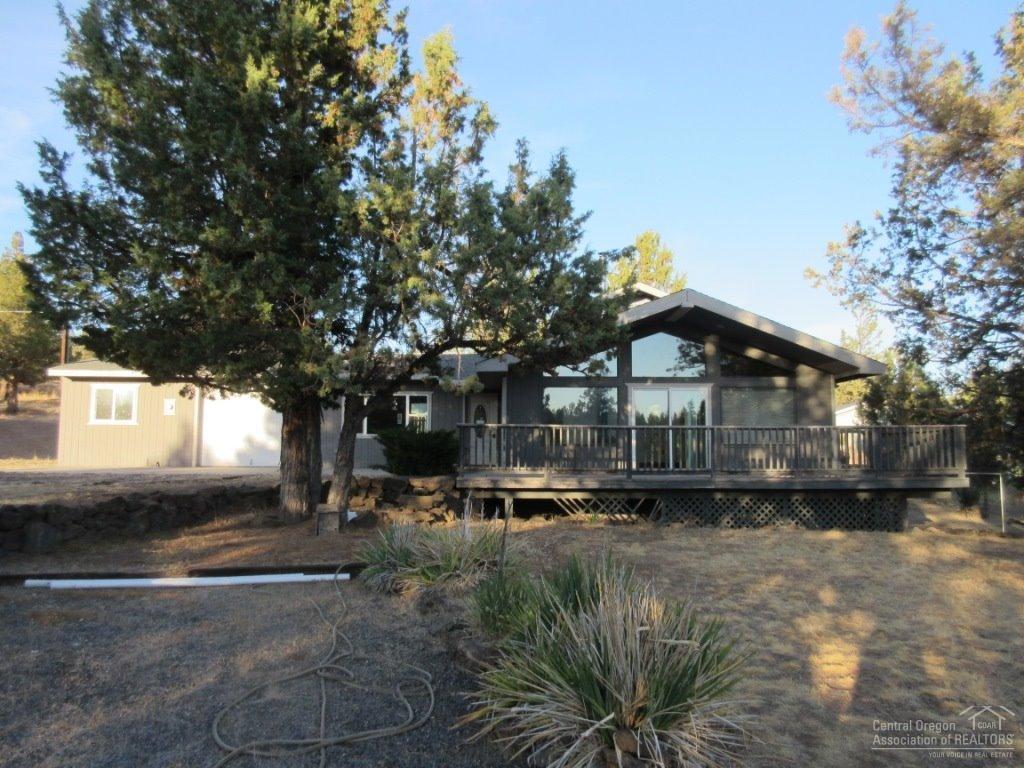 This Homepath property is unique. Located at the end of a very quiet road, the lot is large, and the house is in excellent condition. The interior has just been painted, and brand new carpet has just been installed. The living room is filled with light, and all the wood in the home gives it a very warm feel. The juniper log accents on the stairway are a work of art, and the custom wood doors throughout are beautiful. The appliances are brand new, and the woodstove will keep the place toasty in the winter.
