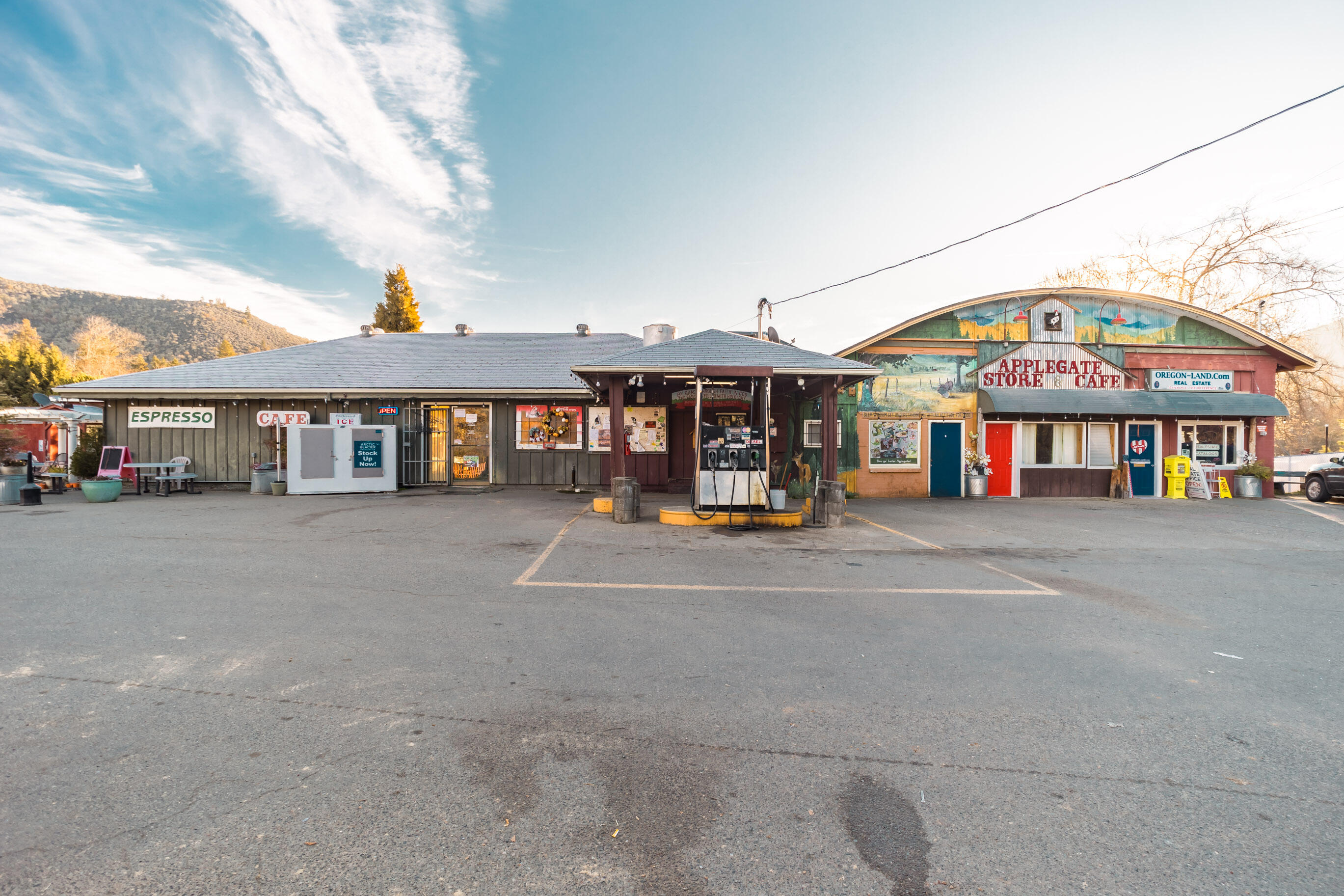 Commercial property in the heart of the Applegate Valley. With gas station, cafe, and convenience store. This property has five income producing leases. All businesses on this property are all well established and thriving. Property has been well maintained by the same family for last 20 years. Upgrades include a high producing well in 2019 and a new roof. Property also includes an acre of vacant commercial land for the new owners to develop to increase income. All tenants on the property have leases and wish to stay. Property also has a 2 bedroom, 1 bath house with a big yard and great views. Agent is related to owners of property