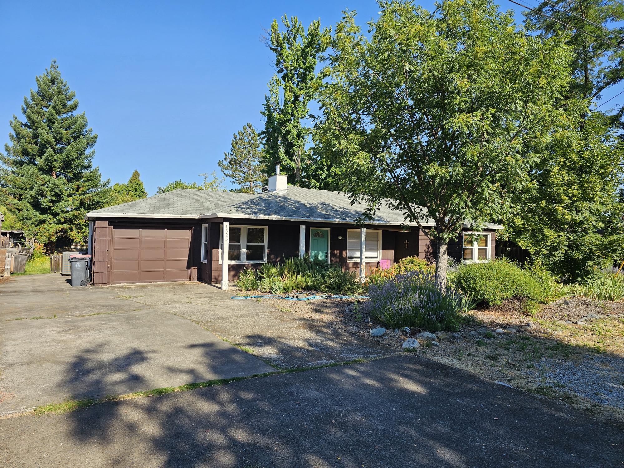 Charming Single-Family Home with Incredible Potential! This well-built single-story home offers great bones and endless possibilities! Nestled on a generous .37-acre lot in a desirable East Medford location, you'll enjoy easy access to hospitals, shopping, and amenities. The home features a quiet, spacious backyard—perfect for relaxing, entertaining, or letting kids and pets roam freely. There's plenty of room for RV parking, and the large lot may even allow for the addition of an ADU - ideal for extended family or rental income. With its central location and potential for customization, this property is a must-see!