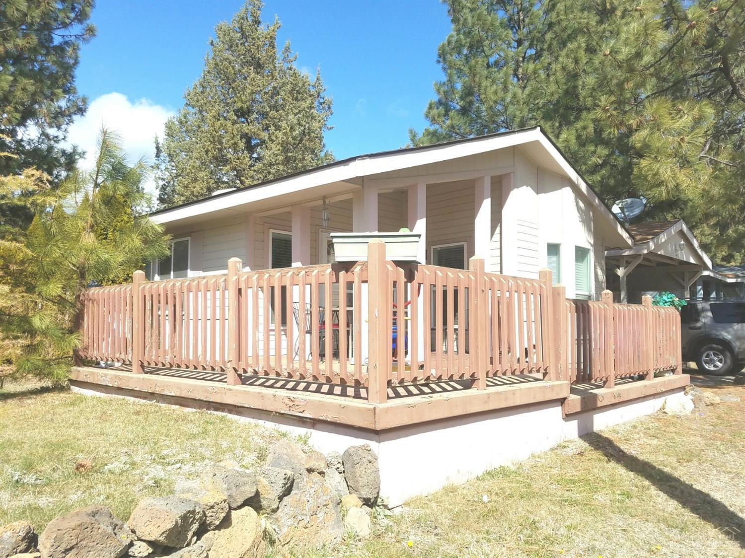 Located in Fox Hills, on large corner lot in desirable SW Bend close to MT, Bachelor, Downtown & The Old Mill District. This 3 bed,2 bath 1568 Sq ft home has living and family room with vaulted ceilings and built ins, a nice kitchen with breakfast bar, a large master with large bath w/double vanities and soak er tub, a huge fenced backyard with lg storage/shop, and Carport. Space rent in 605.00 mo. and includes water.