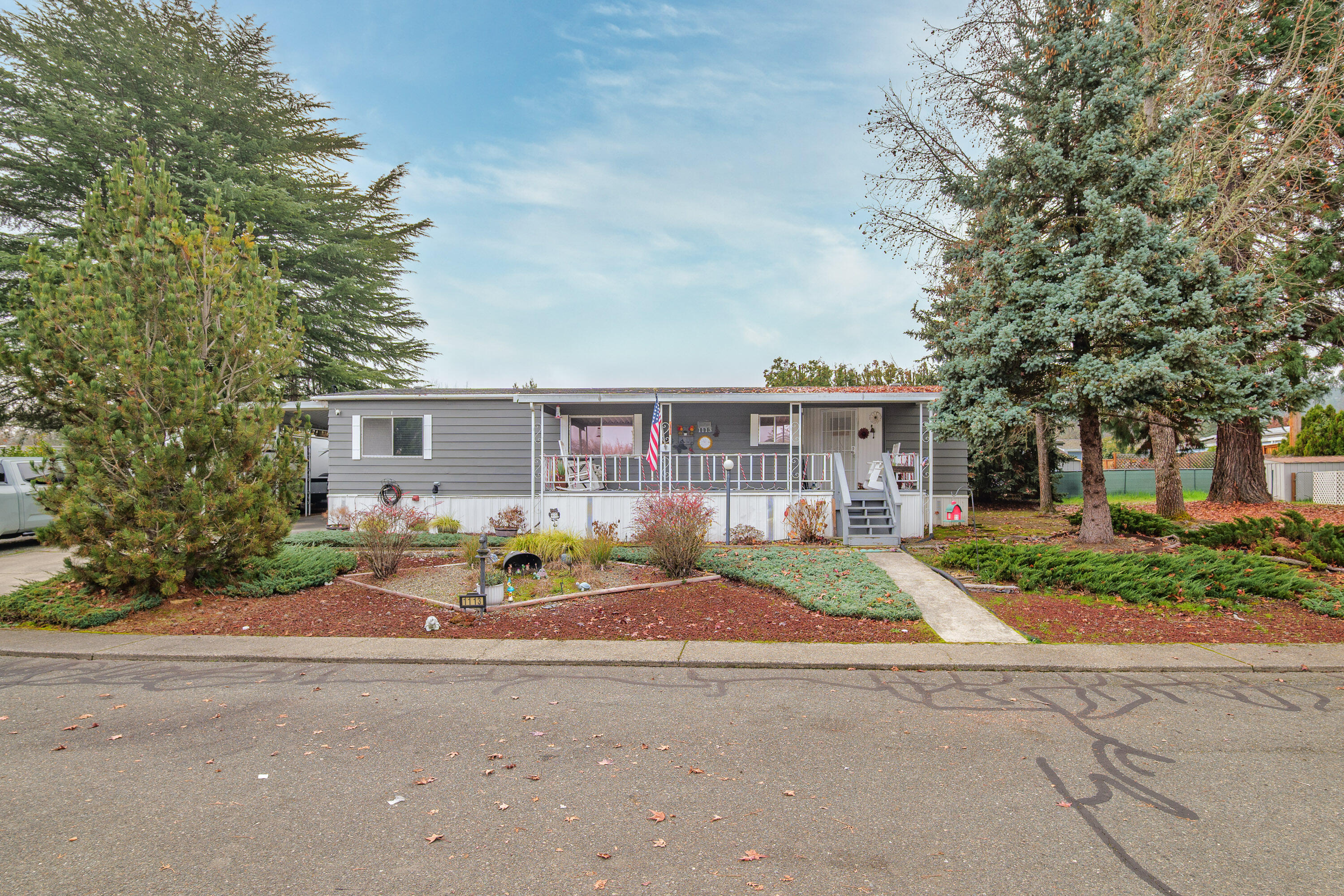 Welcome home to this thoughtfully remodeled manufactured home offering comfort, function, and a welcoming feel throughout. Drywall in every room creates a clean, updated look, and the kitchen has been refreshed with new cabinet faces and an added pantry for extra storage. The dining room features a large built-in china hutch, adding both character and functionality. The well-designed floorplan offers 2 bedrooms and 2 bathrooms with updated tile showers. Recent improvements include new PEX plumbing, steel exterior doors, a newer roof, and excellent insulation for year-round comfort and efficiency. Located at the end of a quiet cul-de-sac within a 55+ community, the .20-acre lot provides space for RV parking, gardening, and enjoying a peaceful, private setting. Move-in ready and well cared for, this property offers a great blend of indoor updates and outdoor flexibility. Park rent includes: water, sewer and trash.