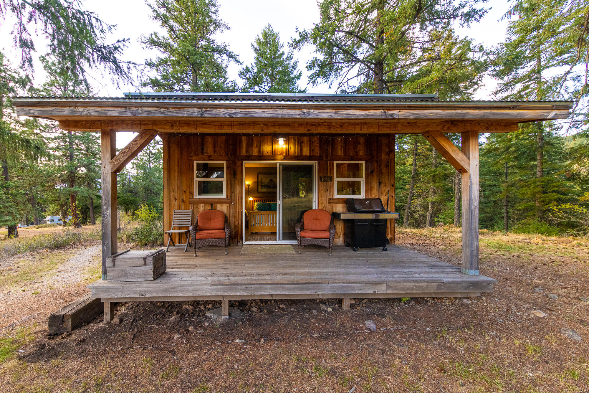 Privacy in the pines! This off-grid hidden gem has a non-expiring homesite, 3 ac of permitted nursery groundwater irrigation rights, an active OLCC producer license, 7.6kw solar system with 16kw lithium-ion battery bank, insulated shop, a cozy cabin, and 4 bedroom septic system installed. With open meadows, tall trees, superb southern exposure, and clean air this property can fulfill so many dreams. The water is clean, clear, and flowing even in our current historic drought. The studio cabin is a great pad while you build your dream home, and the meticulously built 864 sqft shop is fully insulated, has a full bath, and is perfect for drying and curing. Two 30x96 cold frame greenhouses with oversized tubing add to the outdoor canopy extending your season. With OLCC recommending an additional 2-year moratorium on licensing don't wait as this is the most affordable recreational licensed property in the county!