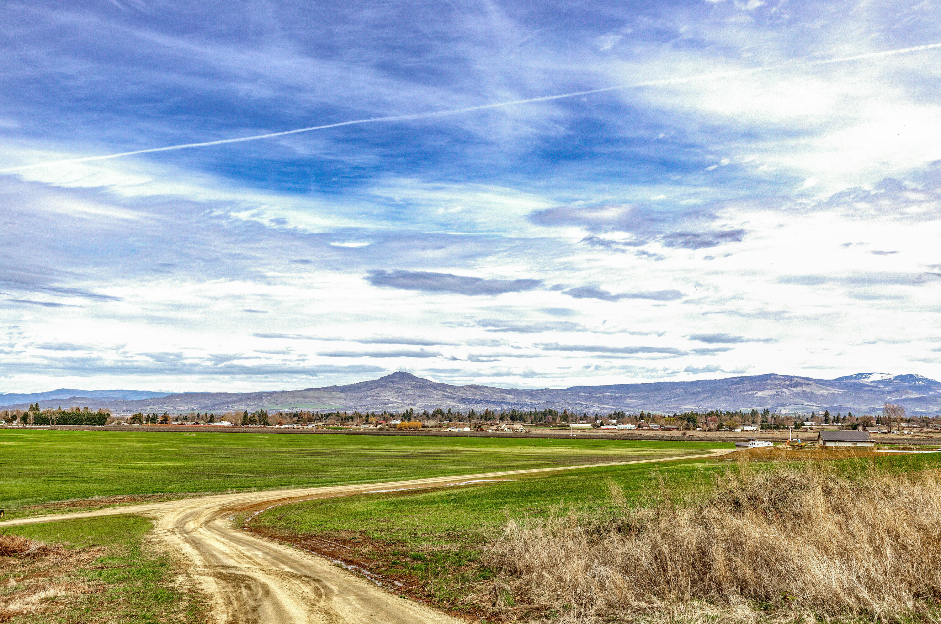 Discover 72 acres of prime land in the heart of Southern Oregon wine country, adjacent to Historic Jacksonville. With irrigation rights and flat, tillable ground, this parcel is perfect for your dream home or agricultural venture. Enjoy breathtaking views of rolling hills and distant mountains, offering daily inspiration. County approval for a homesite ensures you can build amidst this natural beauty. Whether you dream of a vineyard soaking in the Oregon sun or fields of hay swaying in the breeze, the possibilities are endless. Experience the harmony of rural living and modern convenience, with Jacksonville's historic charm just moments away. Seize the chance to create your own haven in this excellent location, where the allure of Southern Oregon's wine country awaits. Buyer to complete their own due diligence with regards to any and all uses.