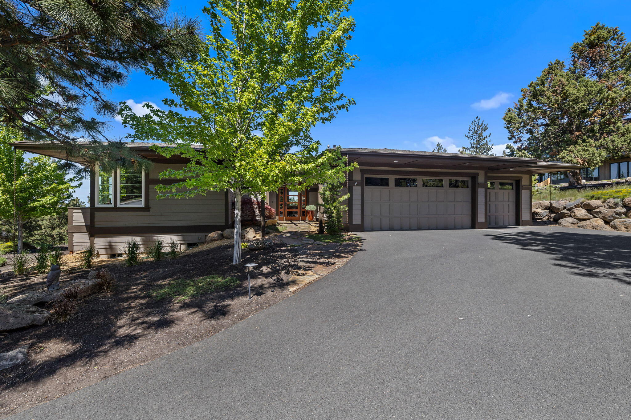 Wonderful one level in NW Bend on .44 acres with views from Smith Rock to the Cascades offers huge windows, 3 bdrms, 2 baths, and 2400 sqft. This pristine home has oak floors throughout,  oversized granite countertops with tile accents in the kitchen, Hans Grohe faucet, custom cabinetry, cherry in great room, laundry room, and bamboo in bathrooms. Custom cabinet pulls and designed wooden closet systems in walk in primary bedroom closet. The primary has heated flooring in the bathroom. 2-zone forced gas hot air with Aprilaire Electrostatic hepa-grade filter system
The home has Hardiplank fire-resistant siding, blown in insulation in 2X6 walls & ceilings for extra R-Value & sound dampening. Oversized 12-foot-wide 3-panel sliding glass door to front patio, 8-foot tall, extra wide doors with no steps. In addition there is a 3 car garage with oversized 18-foot-wide door for double bay.  All new landcaping and HOA fire resistance completed.