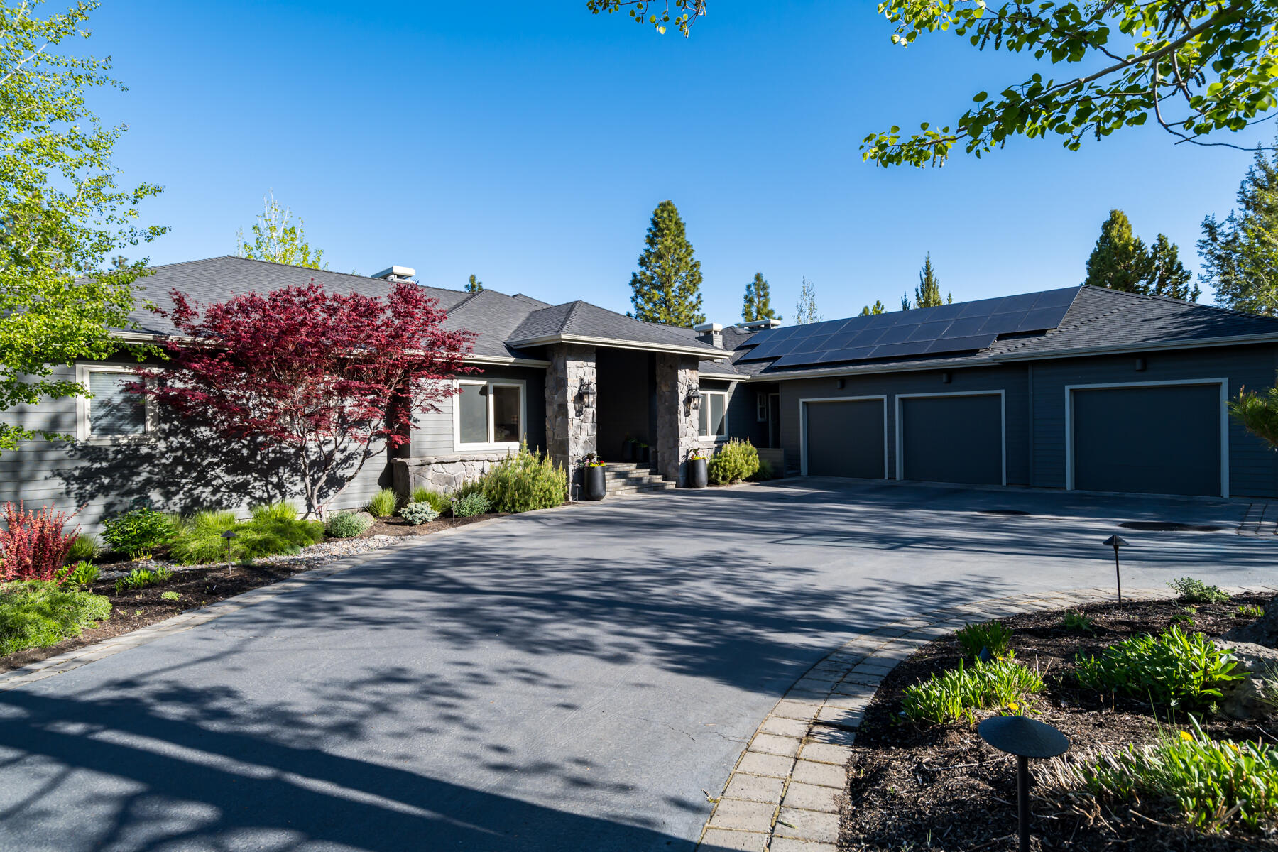 Contemporary elegance, MAIN LEVEL LIVING and phenomenal Cascade Mountain views on Bend's Westside! Located on .71/acre on Awbrey Butte, this thoughtfully designed home offers space, quality craftsmanship, and exceptional eco-friendly features, including a new 43-panel solar system and 2 EV charging ports. Enjoy looking out to truly sweeping views of the mountains as you create and entertain in the Chef's kitchen w/solid surface counters, new appliances and large working island. Kitchen opens to delightful family rm w/gas fp and dining area w/access to expansive covered back deck, blending indoor/outdoor living seamlessly. Light-filled formal living area w/soaring ceilings, huge windows and wood-burning fireplace- an entertainer's dream! Additionally on Main Level: Primary Suite, 2 large BR, 2 full BA and spacious home office. Daylight basement: 4th BR, full BA, FANTASTIC Bonus Rm, plus Game Rm, and wine cellar. Oversized 3-car garage w/excellent storage for all your Bend adventures.