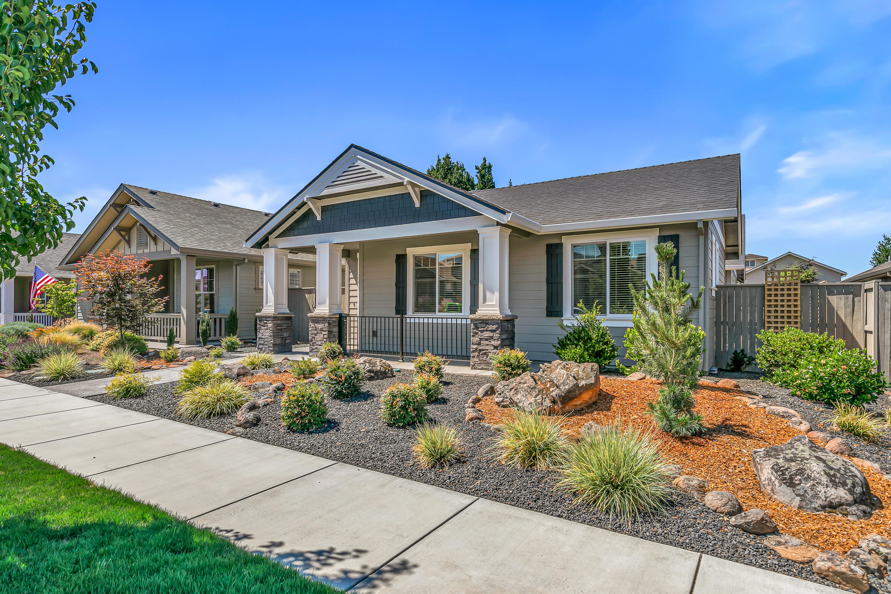 This custom Summerfield Cottage combines timeless charm with modern comfort. An open floor plan with wide-plank hardwood floors, shiplap ceilings, and a stone fireplace creates a warm, inviting atmosphere. The kitchen shines with quartz counters, farmhouse sink, subway tile backsplash, and upgraded appliances—perfect for everyday living or entertaining. The generous primary suite is a private retreat with dual vanity, large walk-in shower, and spacious closet. Enjoy seamless indoor-outdoor living with level access, a courtyard patio, and refreshed landscaping. Recent updates include beams in the great room, accent interior paint, and custom lighting. Thoughtful extras and close-in amenities with low-maintenance design leaves more time to simply enjoy home.