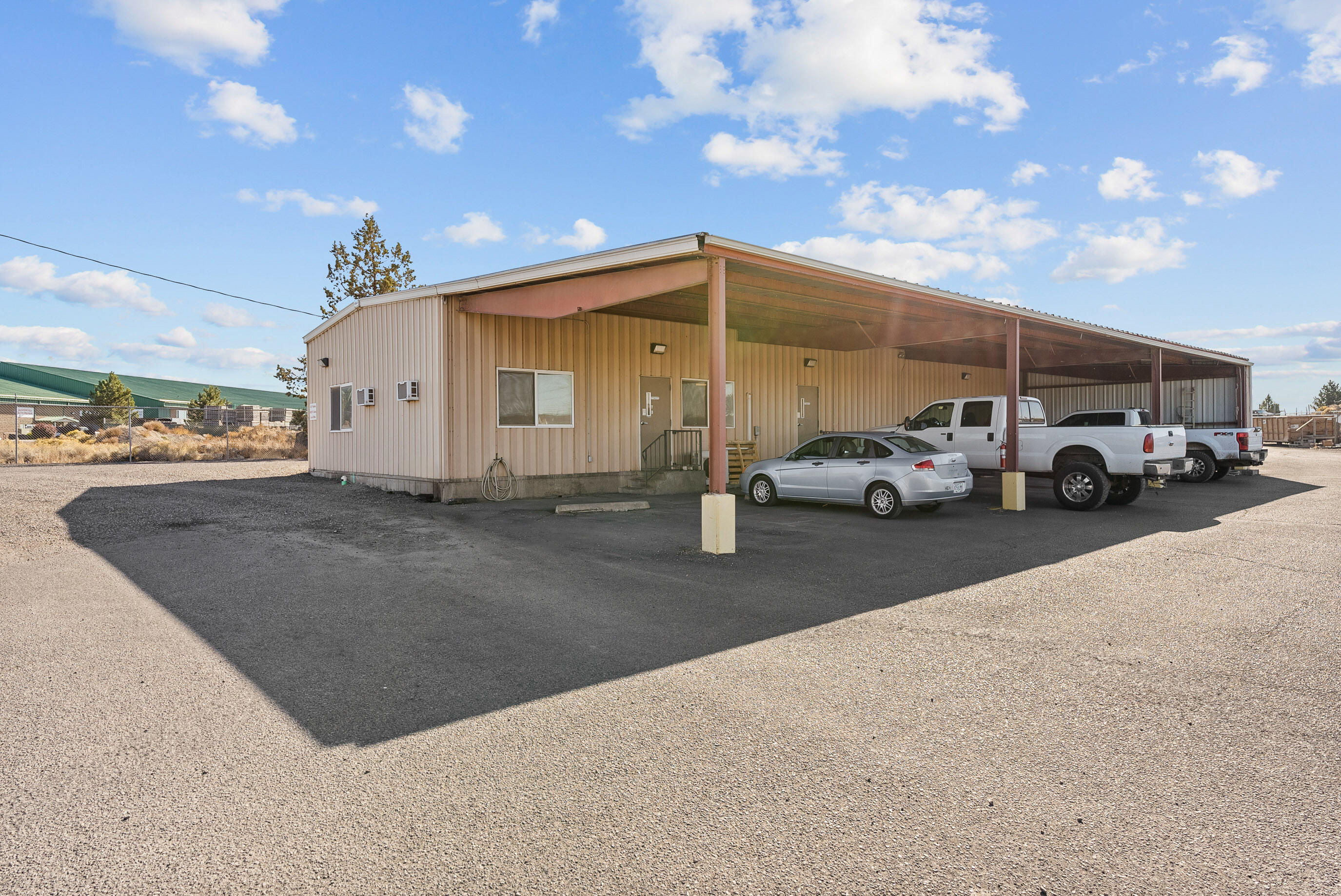Positioned near the Redmond Airport within the Redmond Enterprise Zone, this 2,700 SF light industrial building offers an excellent owner/user opportunity with a versatile mix of office, warehouse, and covered storage areas. The structure features two roll-up doors providing efficient access for shipping, receiving, or light manufacturing operations.
Situated on a 0.88-acre lot with ample yard space, the property allows for outdoor storage or future expansion. Its Light Industrial (M1) zoning accommodates a wide range of business uses. With easy connectivity to Highway 97 and convenient access to Central Oregon's industrial and commercial hubs, the location supports both operational efficiency and long-term growth. Ideal for small manufacturers, service contractors, or local distribution users seeking a flexible and accessible industrial facility in a thriving Redmond submarket.