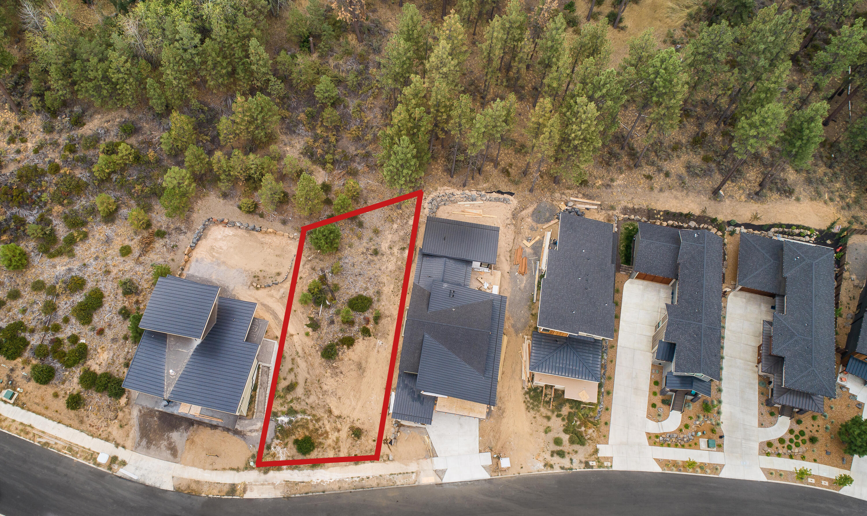 Don't miss this exceptional opportunity to build your dream home in the prestigious Lodges at Bachelor View neighborhood. This .12 acre lot is truly a gem, as it backs to lush green space and is surrounded by state-of-the-art custom homes. Immerse yourself in the beauty of nature with incredible access to biking and hiking trails, allowing you to explore the great outdoors right from your doorstep. Golf enthusiasts will also appreciate the proximity to top-notch golf courses. Whether you seek adventure or relaxation, this lot offers the perfect canvas to create your ultimate playground. Don't miss out on the chance to turn your vision into reality on this remarkable property.