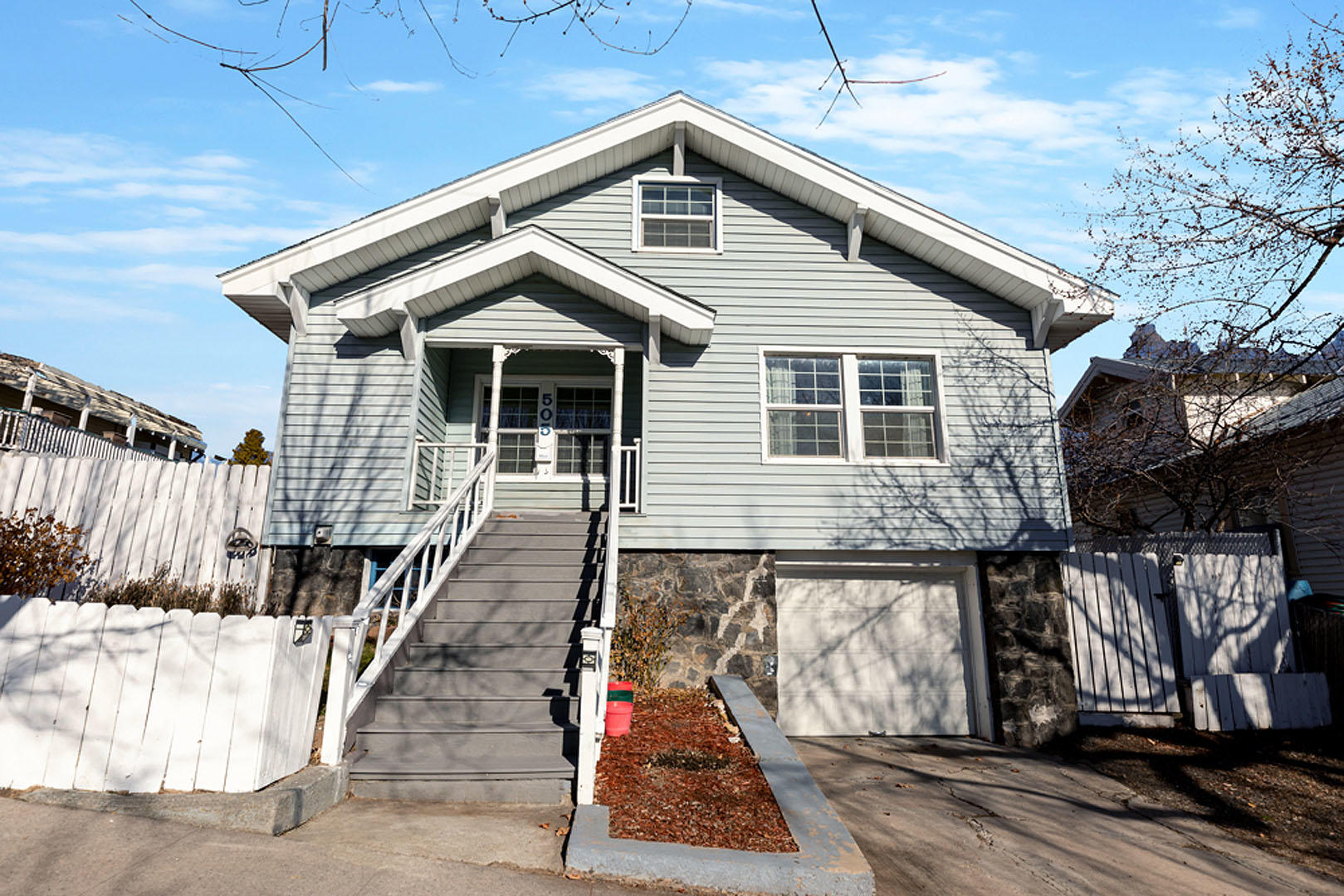 Located above downtown Klamath Falls this craftsman style home has been well cared for with many recent updates. Newer roof installed, grid double-pain vinyl windows, gas water heater, garage door opener, new kitchen faucet and other upgrades. You can actually feel the charm when you walk into the home. This could make a great personal residence, rental or VRBO / Airbnb. This home and property has been super cleaned for the next owner. First floor has two bedrooms with 1 bath. Enter into a wide open space with a real wood burning fireplace. Natural gas cooking stove and includes the refrigerator. Upstairs is more open area and closet storage with two more flex rooms. This home has over 1400 sq ft of living space plus a full garage basement and laundry area. Klamath Falls is a great place to live and is located close to the California border in sunny Southern Oregon. It's a great place to Zoom and work from home, and to be within a short walking distance of downtown Klamath.