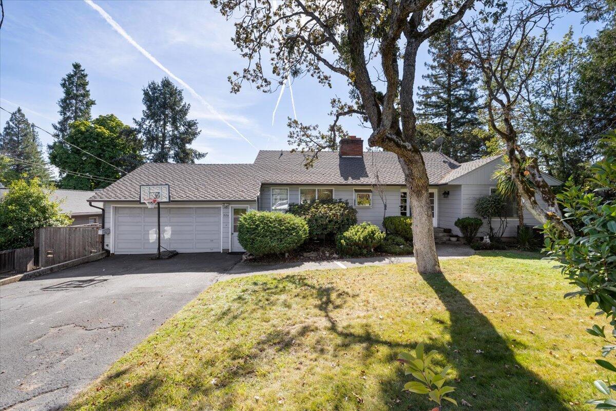 Step into this beautifully designed home crafted by the renowned Frank Clark, and located in the heart of Old East Medford!  This spacious residence seamlessly blends timeless design with modern updates.  The upstairs offers 3 generous bedrooms and 2 full baths, while the downstairs features an extra living space and 2 additional bedrooms, both with private en suites, making it ideal for guests or multi-generational living.  Recent updates include a spacious covered deck, perfect for year-round outdoor entertaining and relaxation.  The home also features newer added mini-splits on both the upstairs and downstairs levels for maximum comfort. Conveniently located, close to schools, shopping and medical facilities.