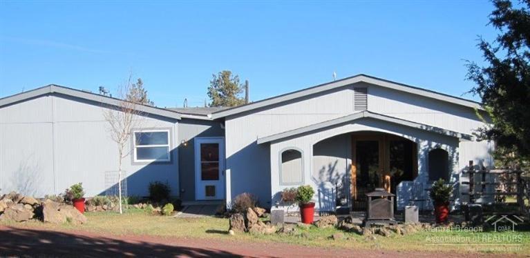 Hold your horses! This is the perfect hobby farm. Immaculate with hardwood & tile floors throughout, you'll love the huge family room, sunny living room, spacious kitchen & big dining area. Outside you'll find a 24x36 4 stall horse barn with tack room, wash rack, loft & hay storage plus a 60' round pen. Park like landscaping in the back with an herb garden, vegetable/fruit garden & lots of flowers. Chicken coops & gravel paths complete the picture. Peek-a-boo Cascade Mtn & Smith Rock views. Not a driveby.