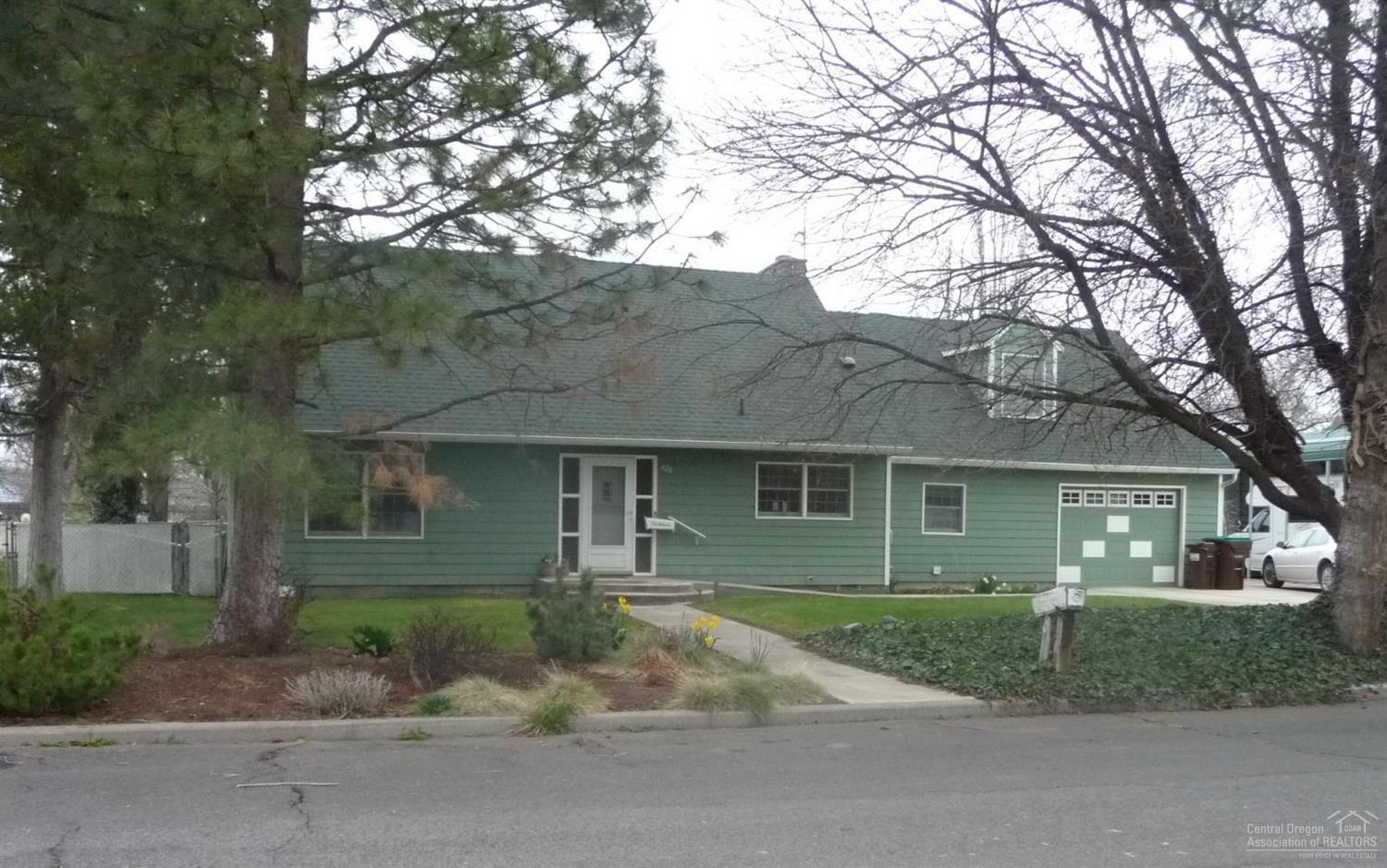 Charming mini farm in the heart of town.Possible street vacation could increase acreage.Original home built in 1971.2004 Remodeling includes kitchen with numerous specialty features,sunny dining room,gas fireplace in living room.Hearth room,downstairs den or 4th bedroom.Huge bonus room & hall bath off original master bedroom, second master suite built in 2004.Upper level 12x14 covered balcony.672 sf garage includes large utility/mud room.Covered RV storage,small barn & shed.Well for outdoor watering.