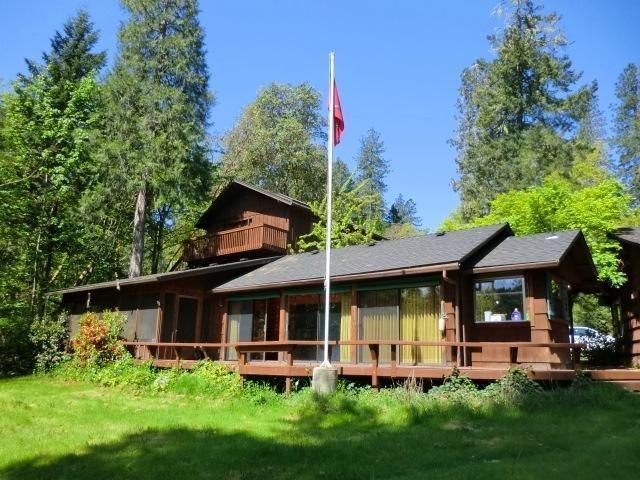 Riverfront lodge retreat on 2.64 wooded acres on the banks of the wild and scenic Rogue River. This property is rare opportunity for a family compound or corporate retreat, offering plenty of peace and tranquility from the city for Vacationers or Retirees. Over 200 feet of river frontage, you'll enjoy the sound of running water, fish jumping and bird watching from your own private deck. Grab your fishing pole and cast your line into the river for some wonderful salmon and steelhead fishing with step right on to the river. This property is very unique and includes four dwellings with a total of 3195 square feet (1Bdrm/1Bath/1027 s/f, 2Bdrm/1Bath/1232 s/f, 1Bdrm/1Bath/360 s/f, 1Bedrm/1Bath/576 s/f). There's a custom 4-car garage w/half bath, RV/Boat parking, separate workshop and a fenced-in garden. This is a one-of-kind property! Don't miss your opportunity to own this piece of the mighty Rogue River's history.